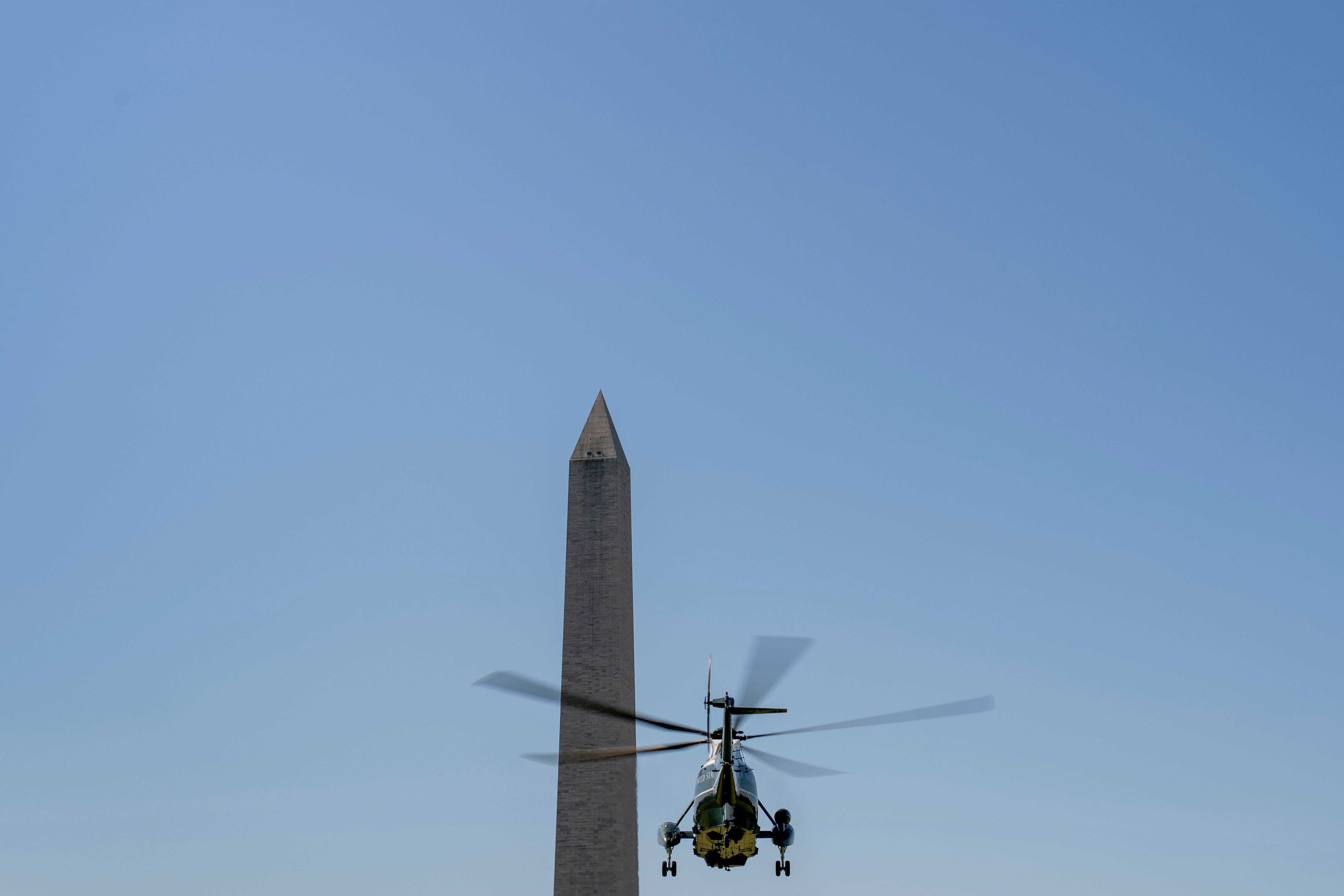 The Washington Monument is visible as Marine One with President Joe Biden aboard lifts off from the Ellipse at the White House in Washington, Tuesday, May 18, 2021, for a short trip to Andrews Air Force Base, Md., as Biden travels to Detroit to visit the Ford Rouge Electric Vehicle Center in Dearborn, Mich.