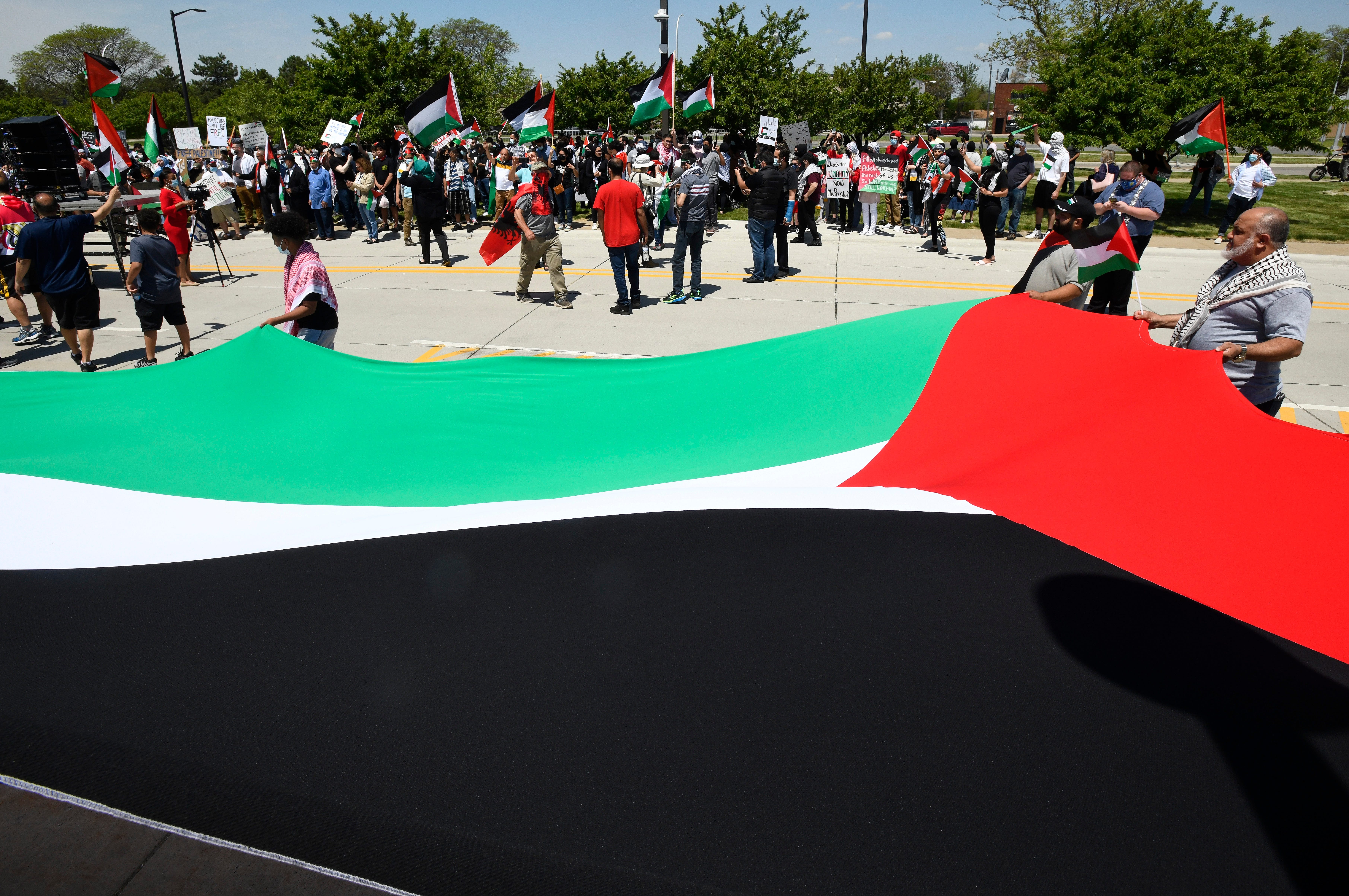A huge Palestinian flag amongst the thousands of protestors at a Palestinian protest and march, at the same time President Joe Biden is visiting in another part of Dearborn, Michigan on May 18, 2021. (Image by Daniel Mears/ The Detroit News)
