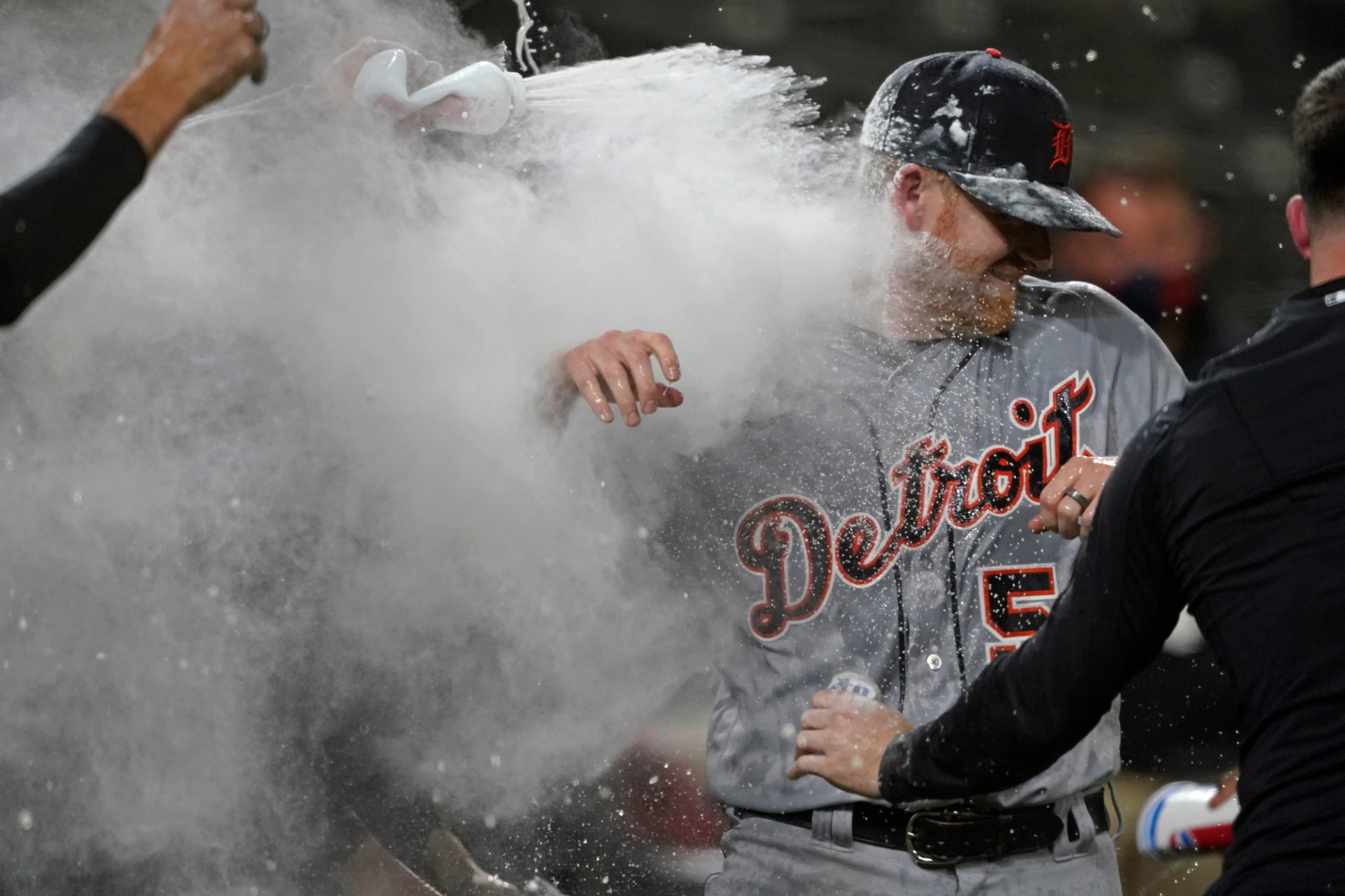 Detroit Tigers starting pitcher Spencer Turnbull (56) is showered with beer and powder by teammates after Turnbull threw a no-hitter in the team's baseball game against the Seattle Mariners, Tuesday, May 18, 2021, in Seattle.