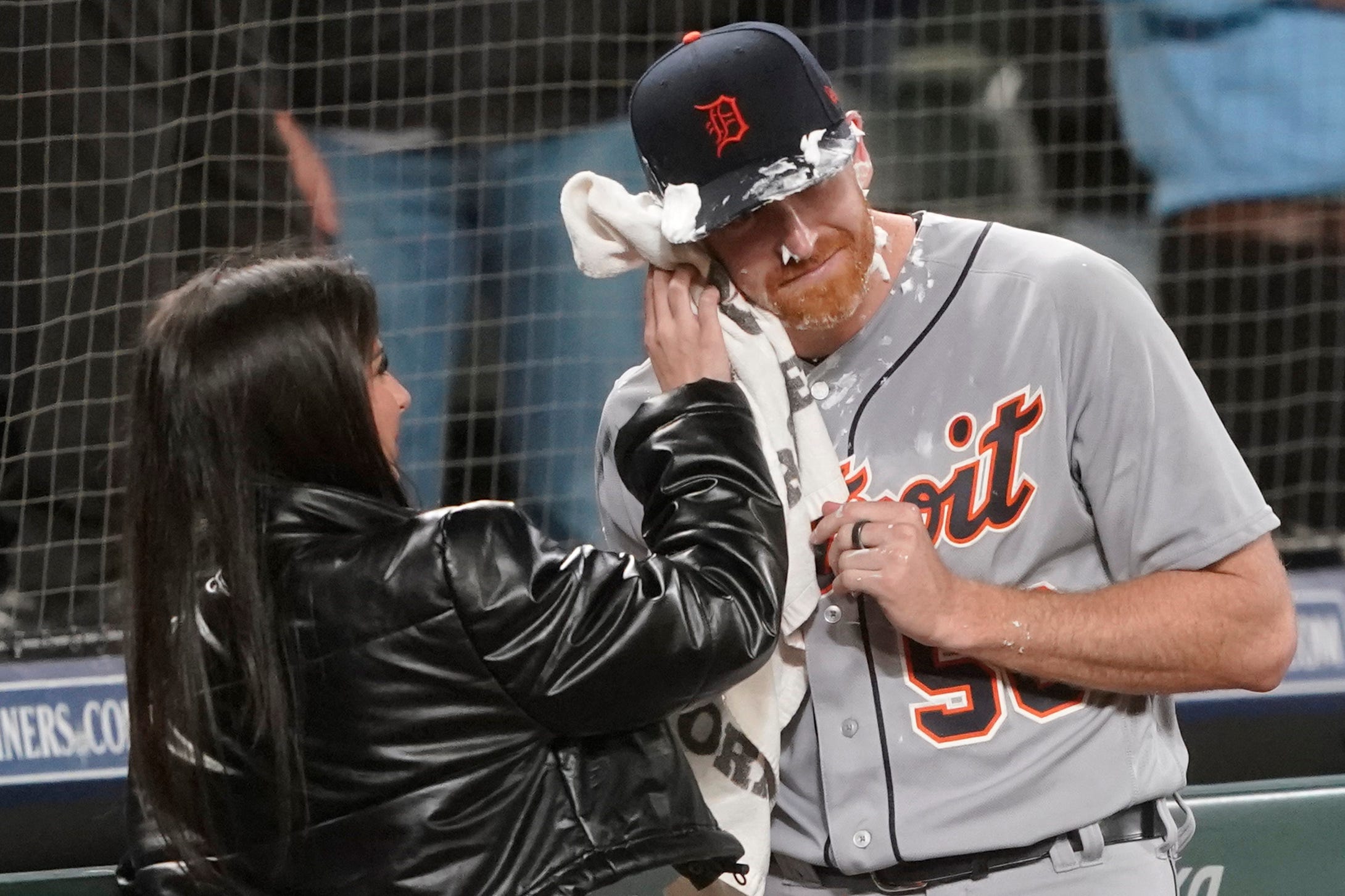 Detroit Tigers starting pitcher Spencer Turnbull (56) has shaving cream wiped from his face by his girlfriend after he threw a no-hitter in the team's baseball game against the Seattle Mariners, Tuesday, May 18, 2021, in Seattle.