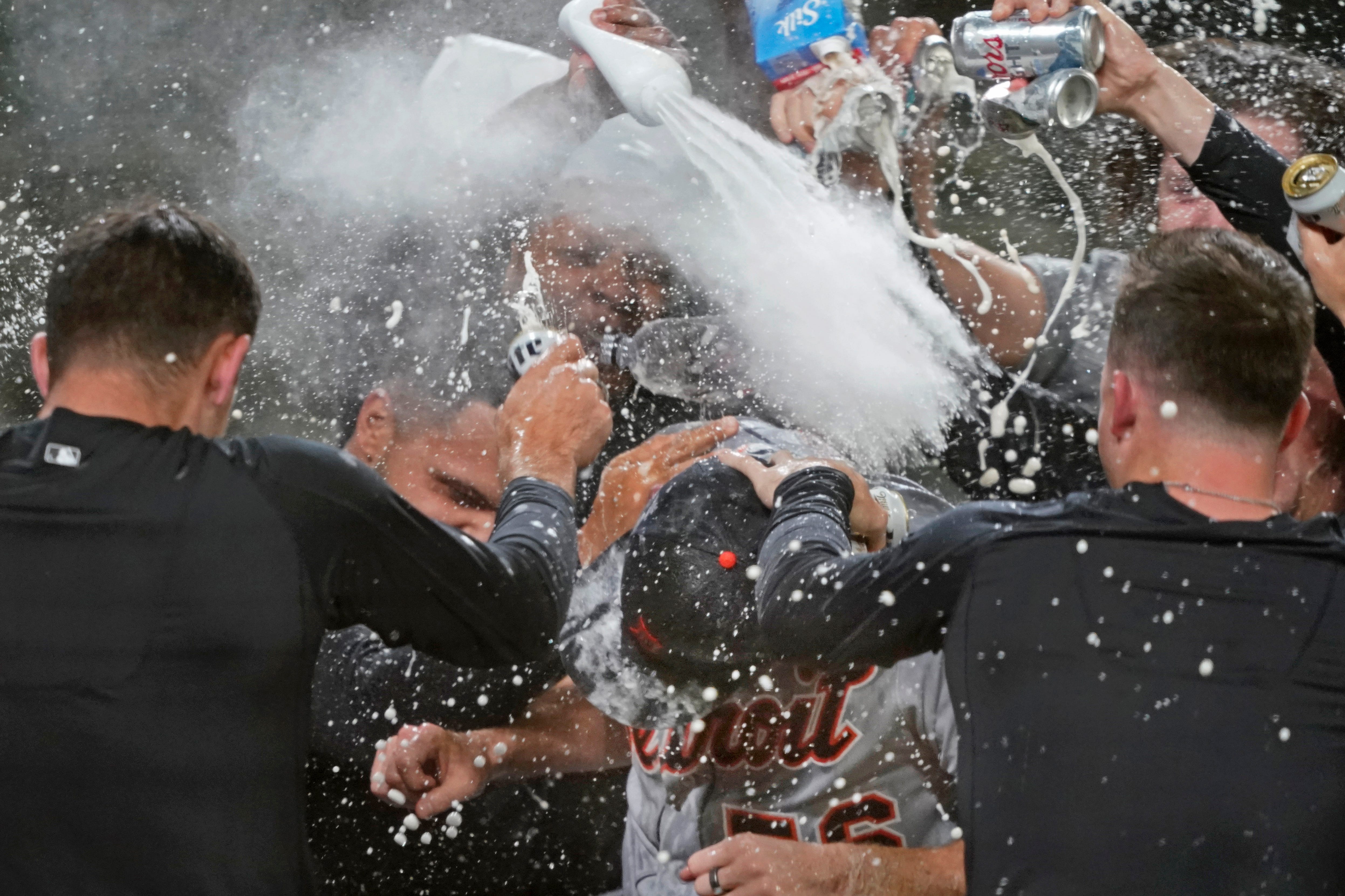 Detroit Tigers starting pitcher Spencer Turnbull is showered with beer and powder by teammates after Turnbull threw a no-hitter against the Seattle Mariners, Tuesday, May 18, 2021, in Seattle.