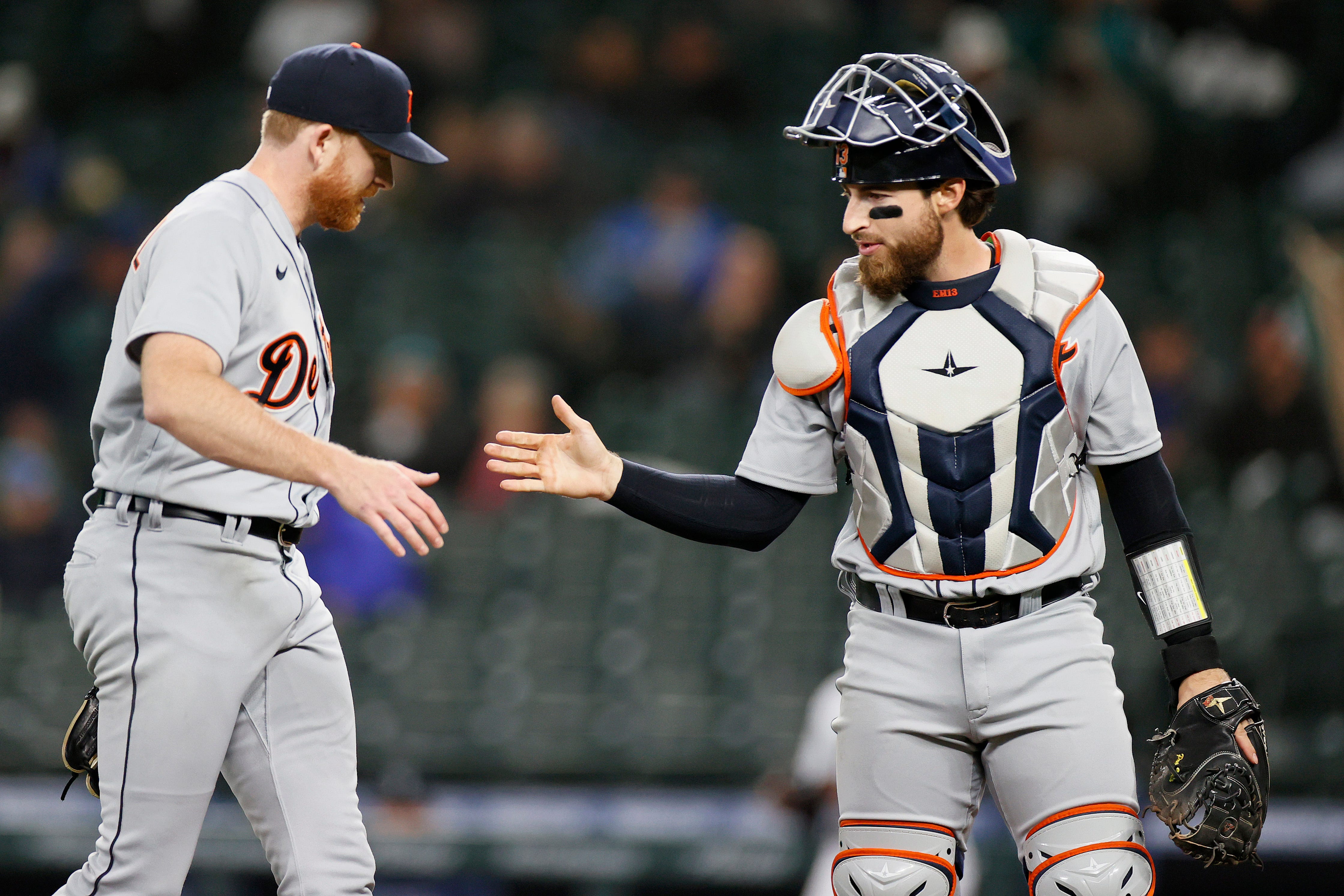 Spencer Turnbull and Eric Haase celebrate after the fourth inning against the Seattle Mariners at T-Mobile Park on May 18, 2021 in Seattle, Washington.