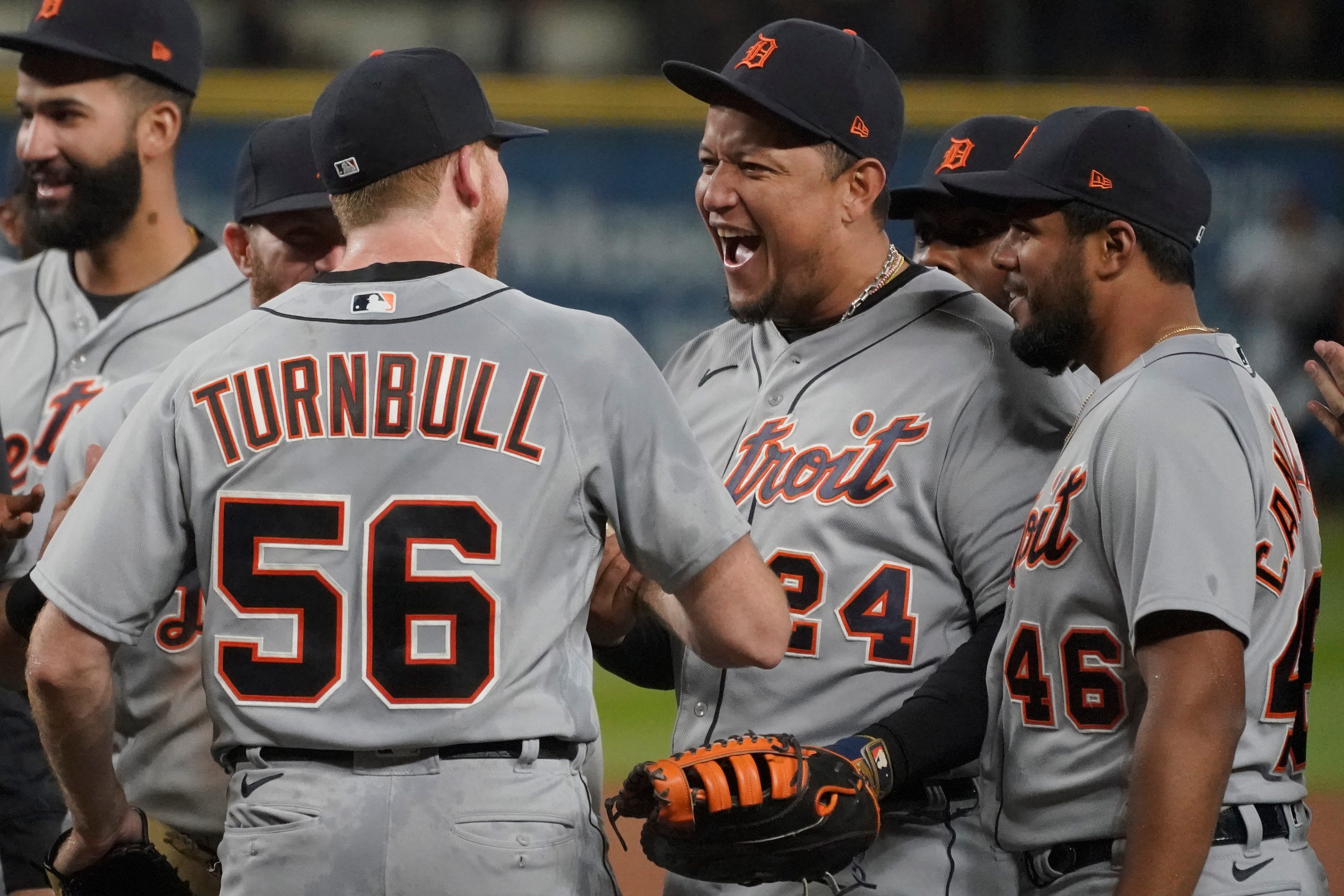 Detroit Tigers starting pitcher Spencer Turnbull (56) is greeted by first baseman Miguel Cabrera (24) and third baseman Jeimer Candelario (46) after Turnbull threw a no-hitter against the Seattle Mariners on Tuesday, May 18.
