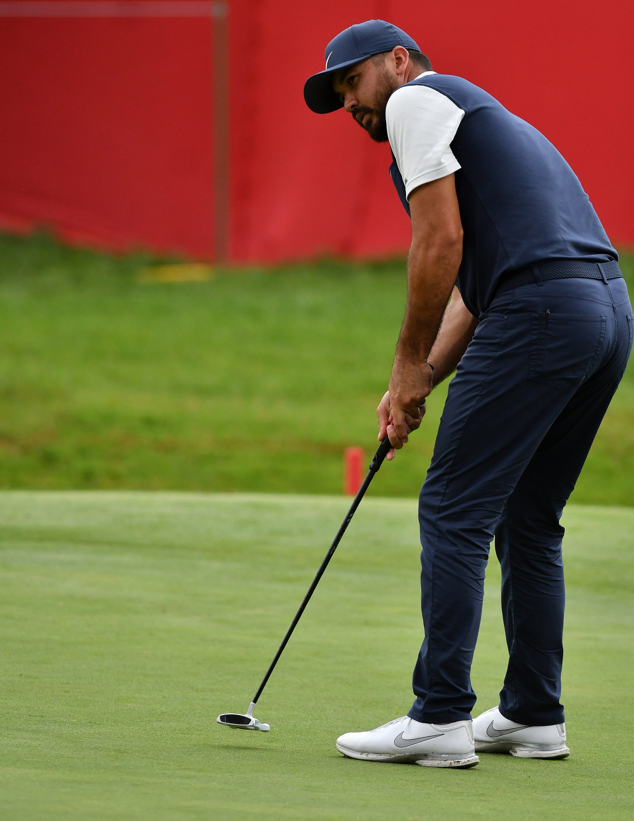 Jason Day putts on the 18th green.