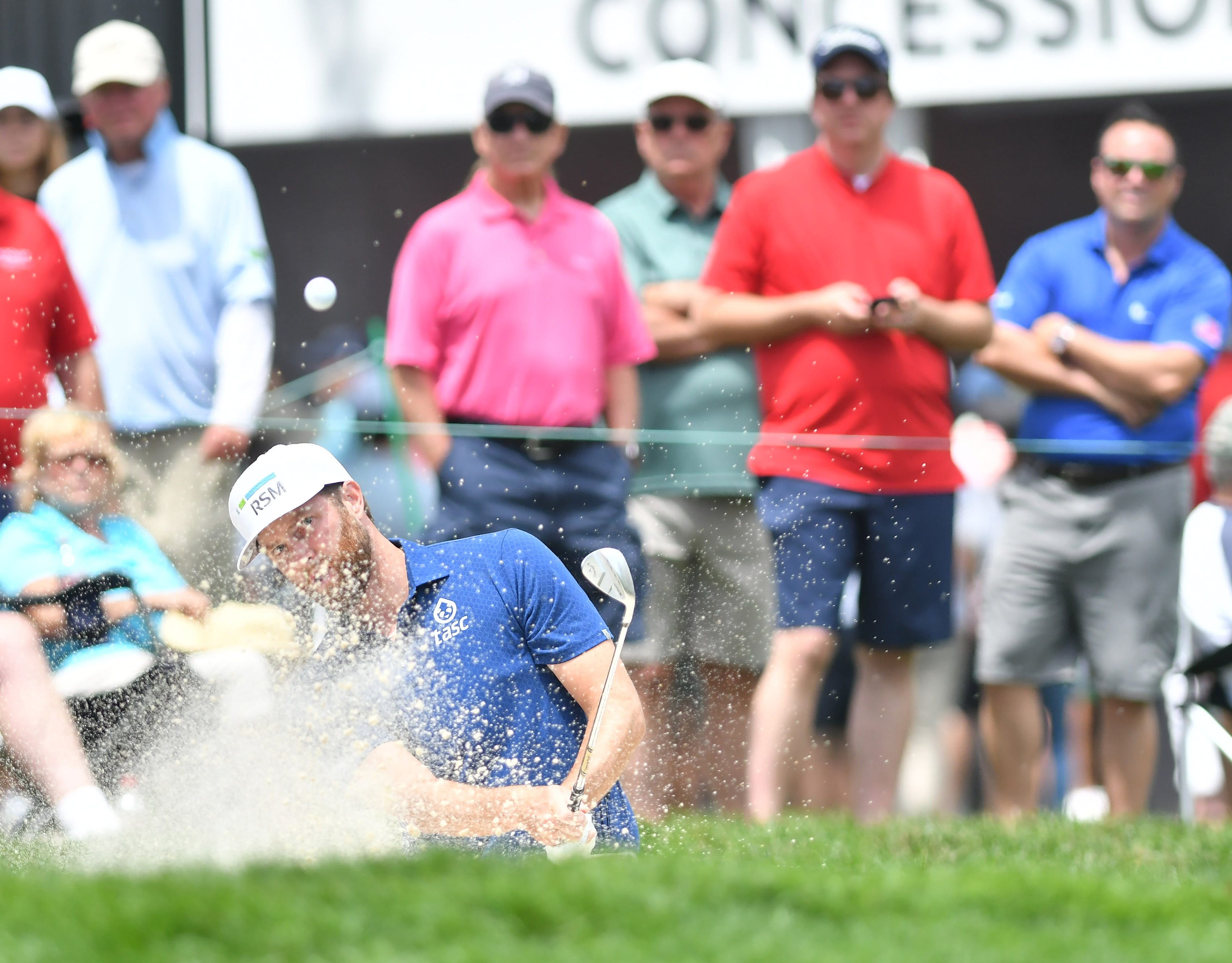 Chris Kirk hits out of the bunker on hole No. 9.