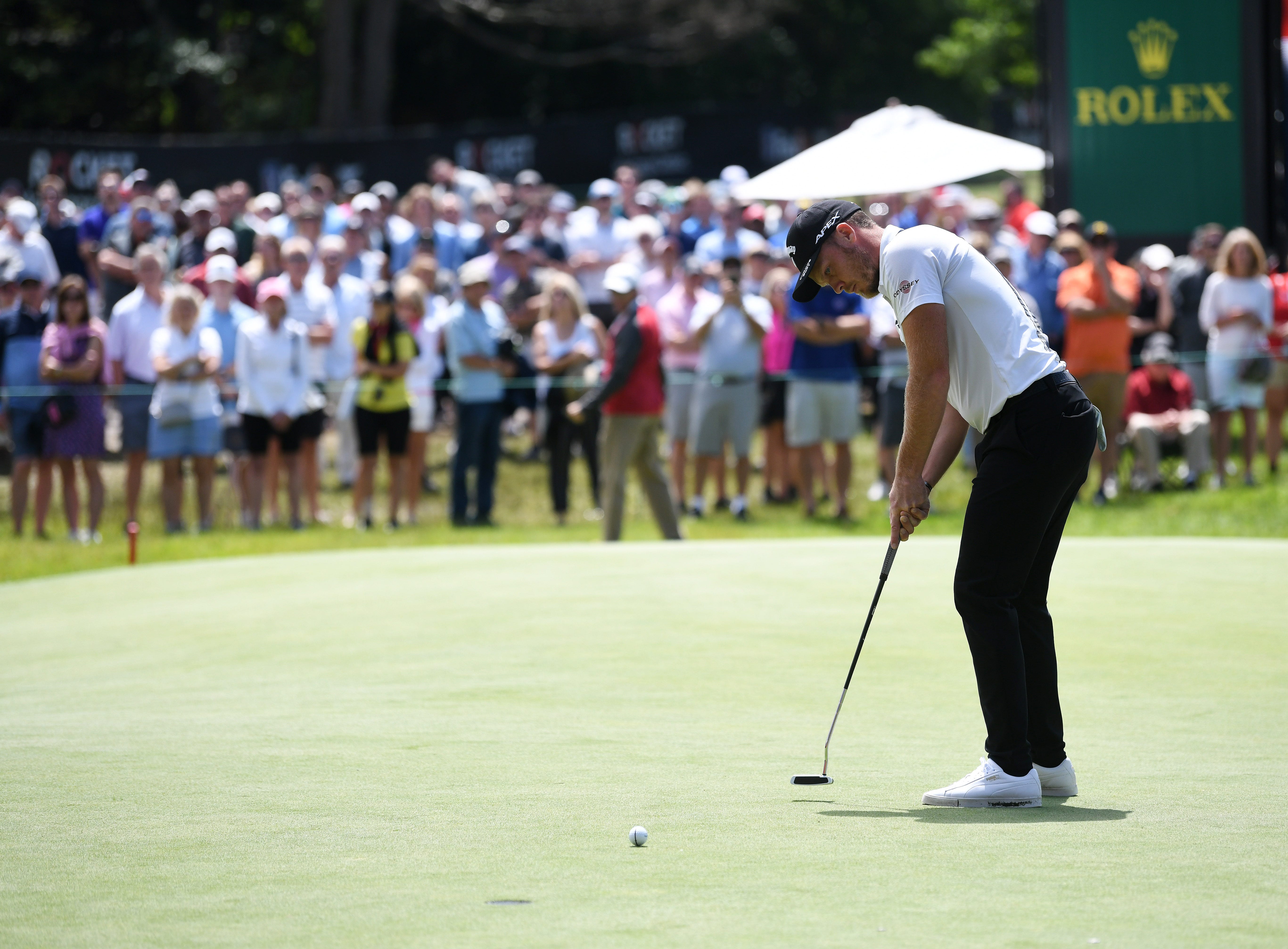 Danny Willett putts on the 18th green.