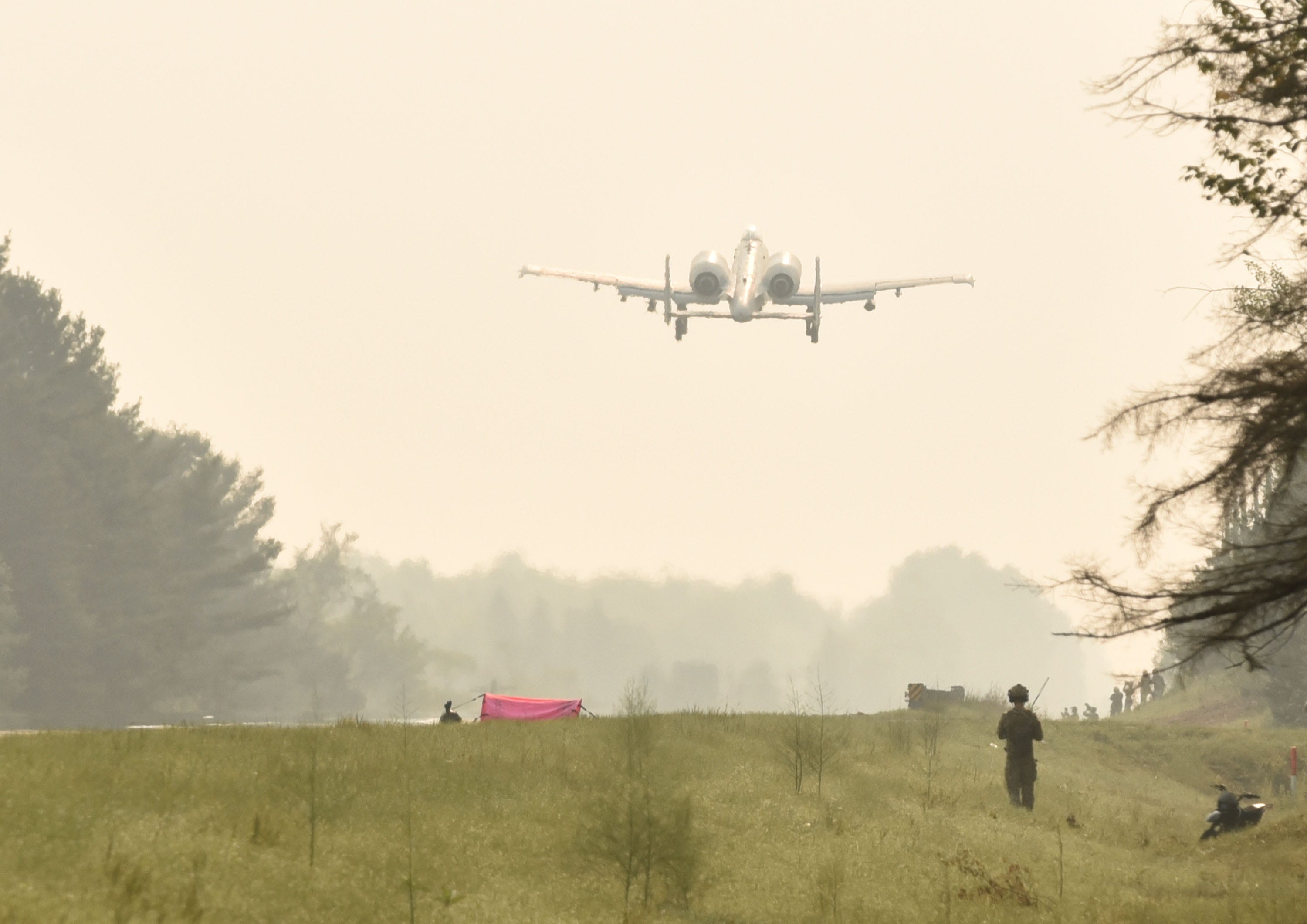 An A-10 jet takes off from highway M-32 west of Alpena Thursday, August 5, 2021, aprt of a training exercise durint the National Guard's Operation Northern Strike. Two A-10's and two C-146 aircraft practiced landing on the highway.