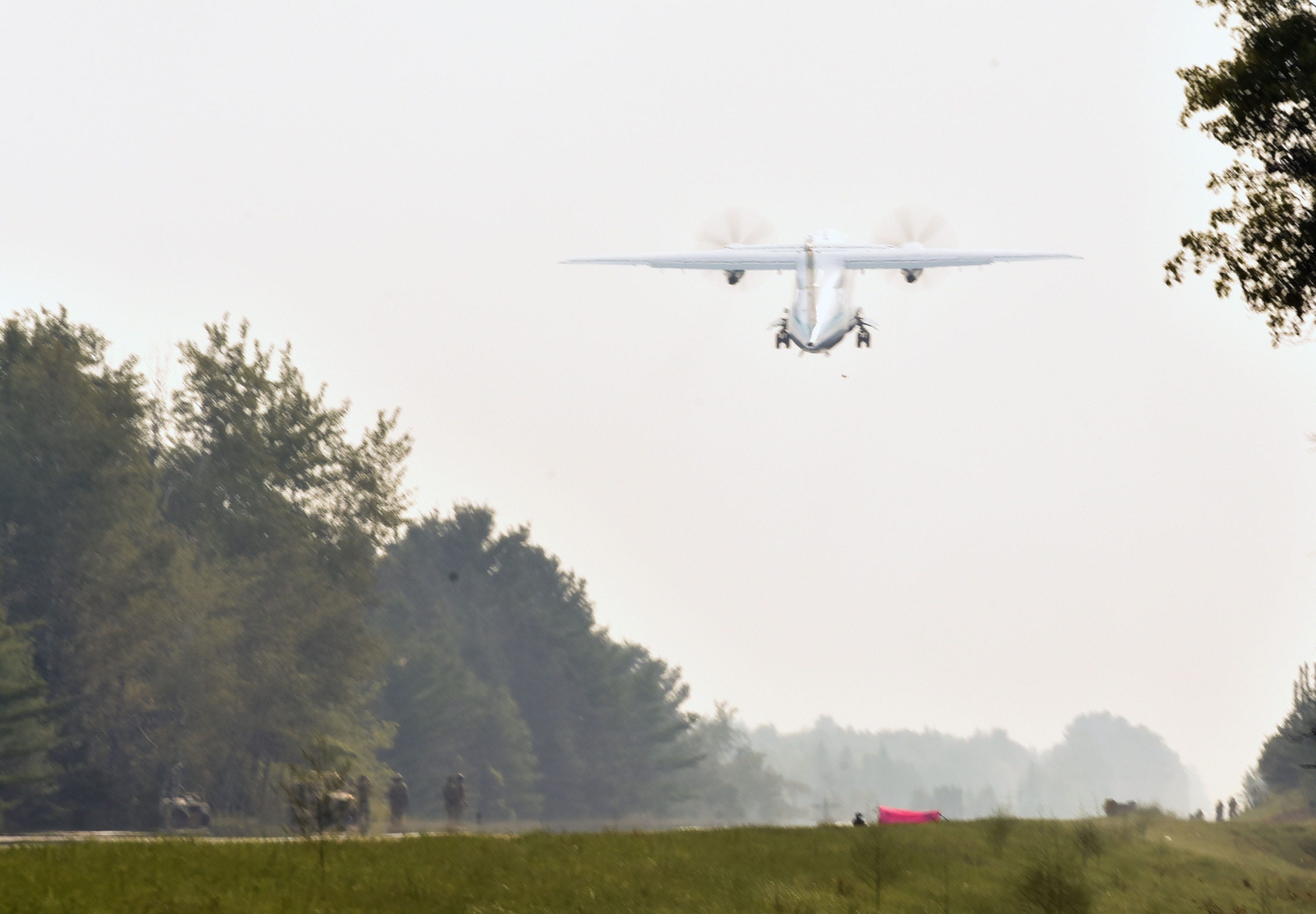 A C-146 aircraft takes off from highway M-32 west of Alpena Thursday, August5, 2021, part of an exercise to practice landing on a highway for Operation Northern Strike.