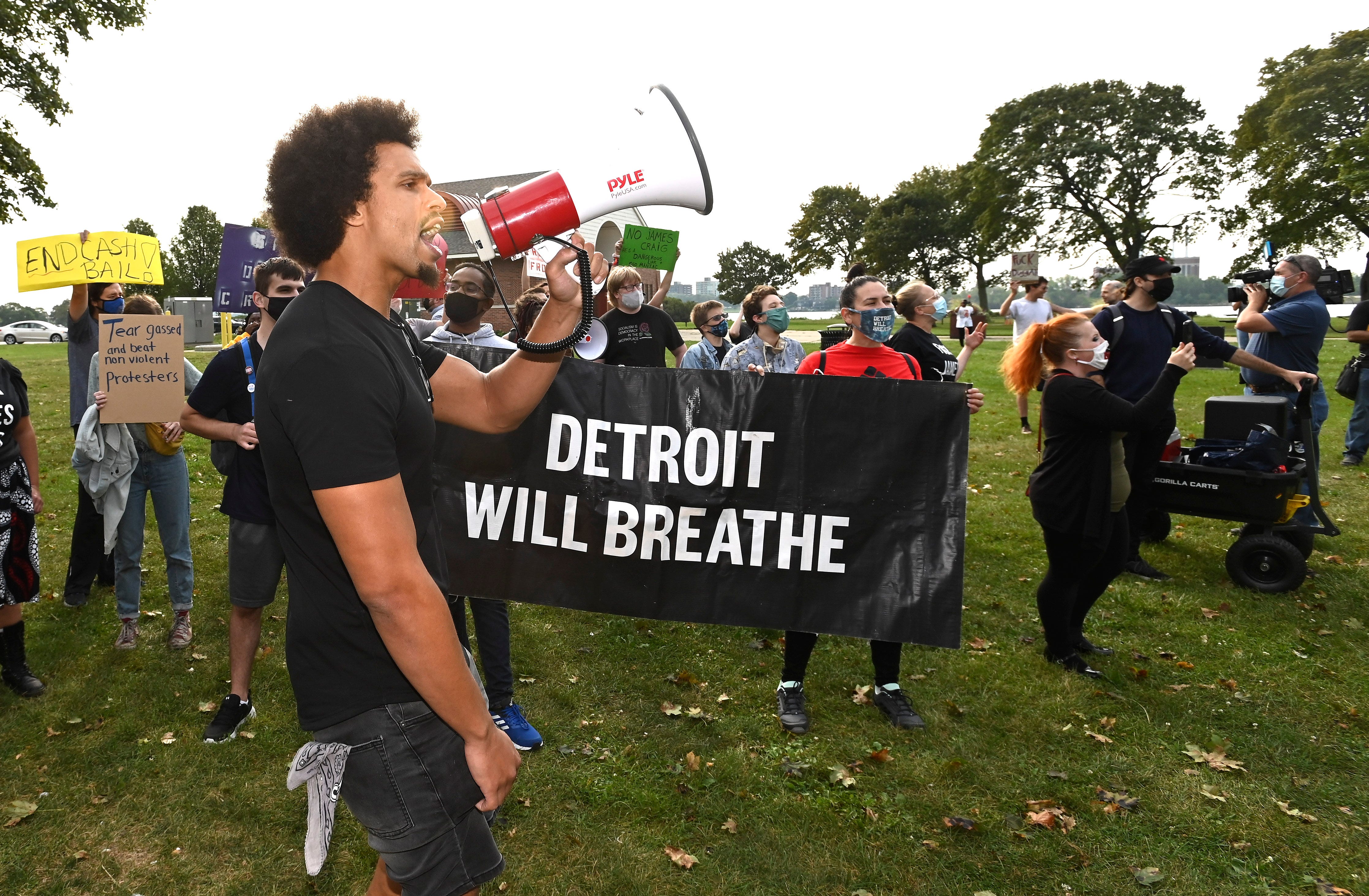 Detroit Will Breathe member Lloyd Simpson, of Detroit, leads anti-Craig chants as a few dozen arrive on Belle Isle before former DPD Chief James Craig arrives, Tuesday morning, September 14, 2021.