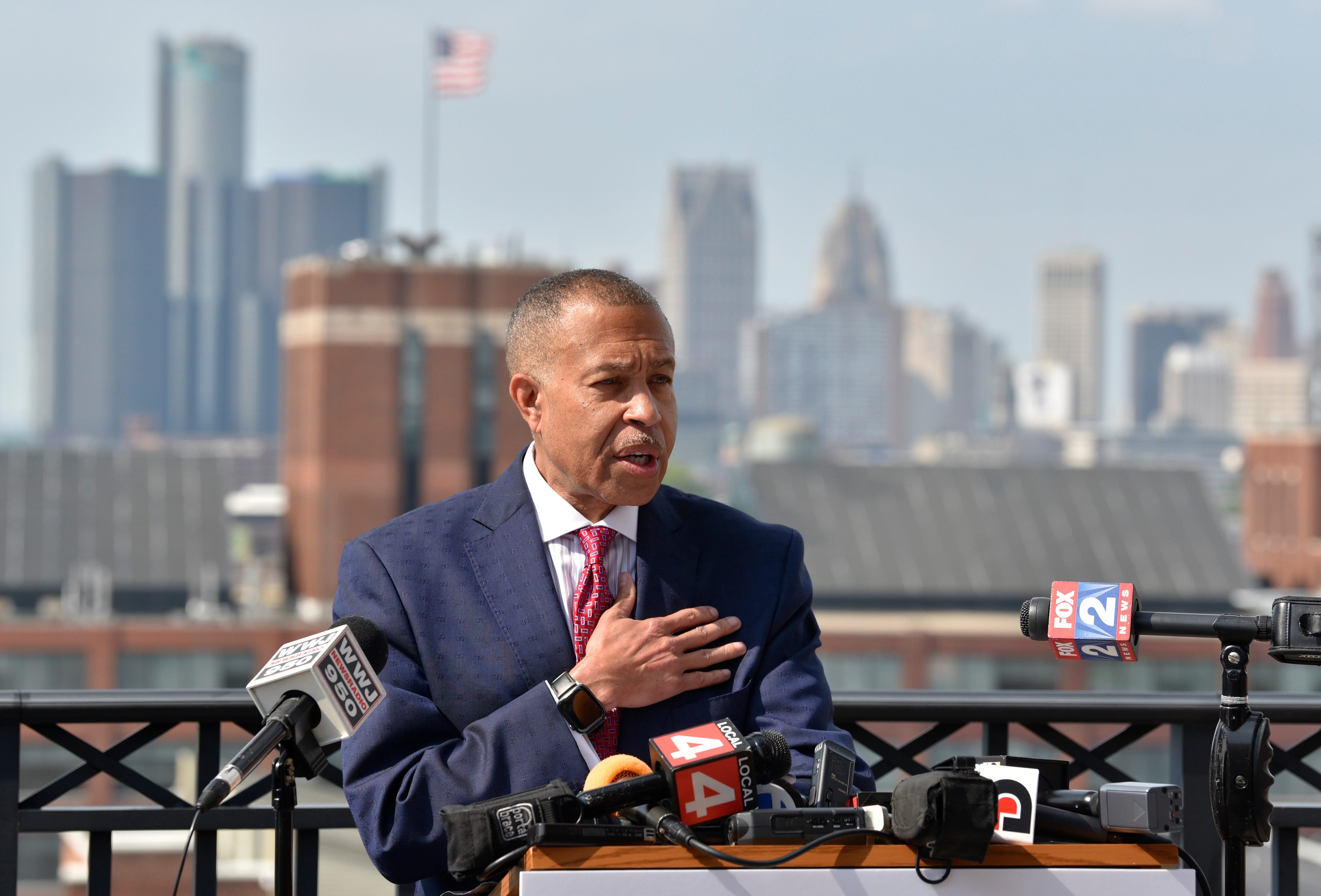 Former Detroit Police Chief James Craig invites supporters and the media in the Pledge of Allegiance as he stands in front of the Detroit skyline before announcing his Republican candidacy for Michigan governor, Tuesday afternoon, September 14 ,2021.