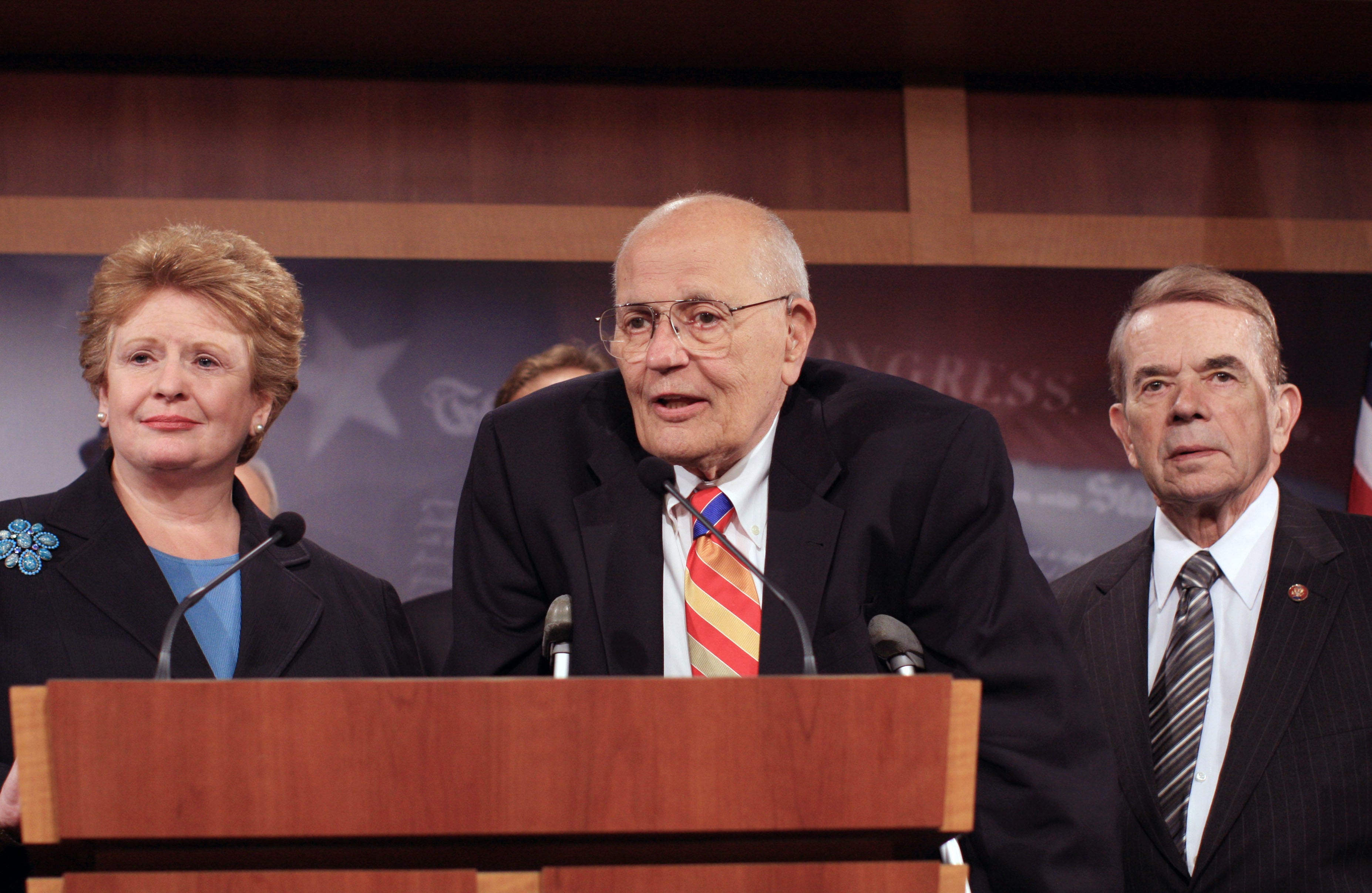 House Energy and Commerce Committee Chairman Rep. John Dingell, D-Mich., center, flanked by Sen. Debbie Stabenow, D-Mich., left, and Rep. Dale Kildee, D-Mich., meets with reporters on Capitol Hill in Washington, Wednesday, Sept. 24, 2008, to discuss a House budget plan expected to be considered by Congress that includes funding for $25 billion in loans for Detroit's automakers.