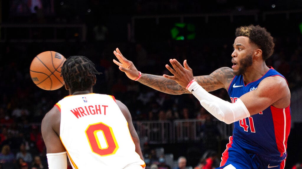 Pistons forward Saddiq Bey (41) passes the ball past Hawks guard Delon Wright (0) during the second half of Monday's NBA game in Atlanta.