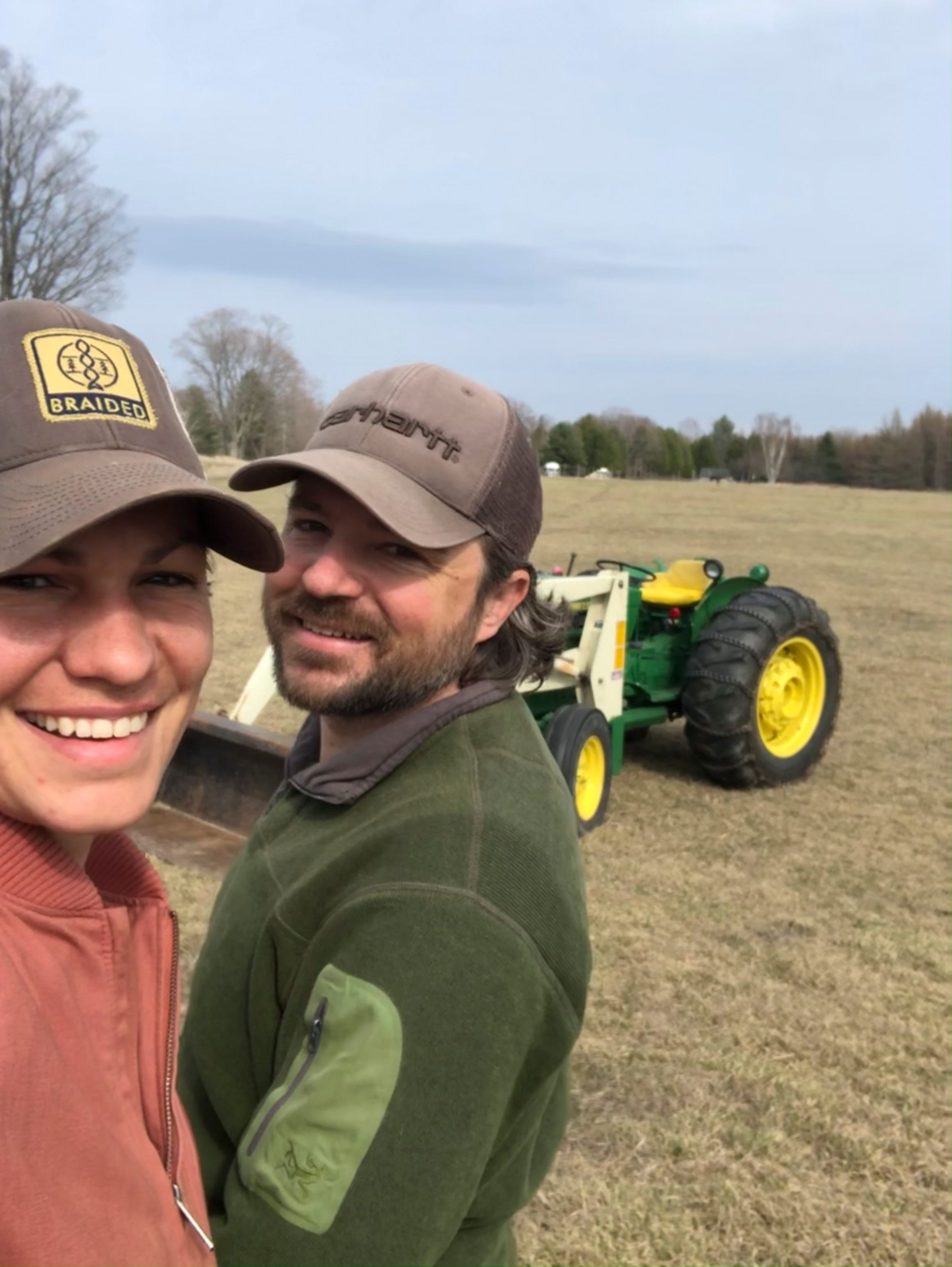 Married couple Kate Leese and Adam Kendall were all smiles on their first day clearing fields for their new vineyard in April of 2021 on Beaver Island.