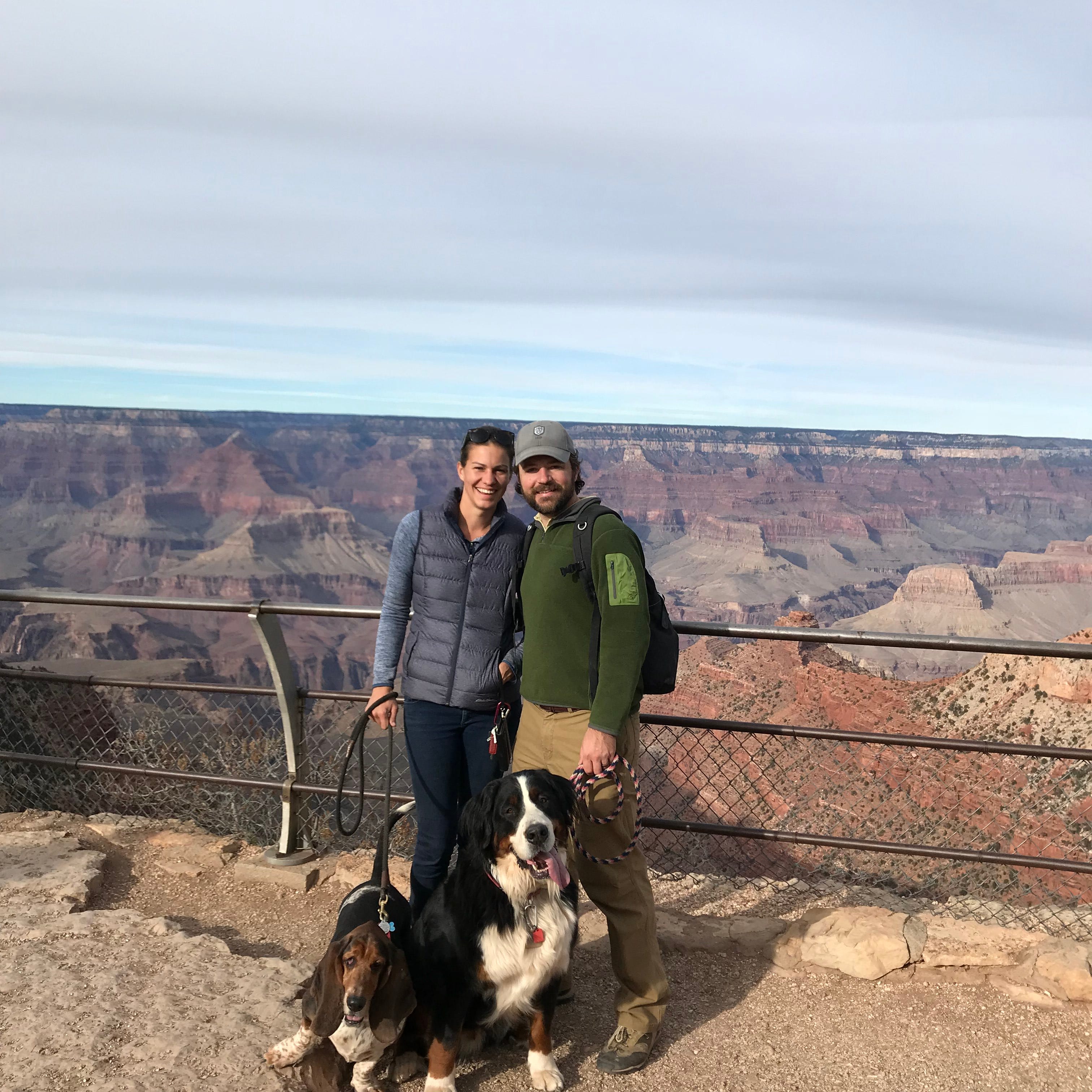 Adam Kendall and Kate Leese, husband and wife, with their two dogs Frank and Baker, (seen here at the Grand Canyon), have been traveling the country since August of 2016 while running their consulting company before starting Antho Vineyards.