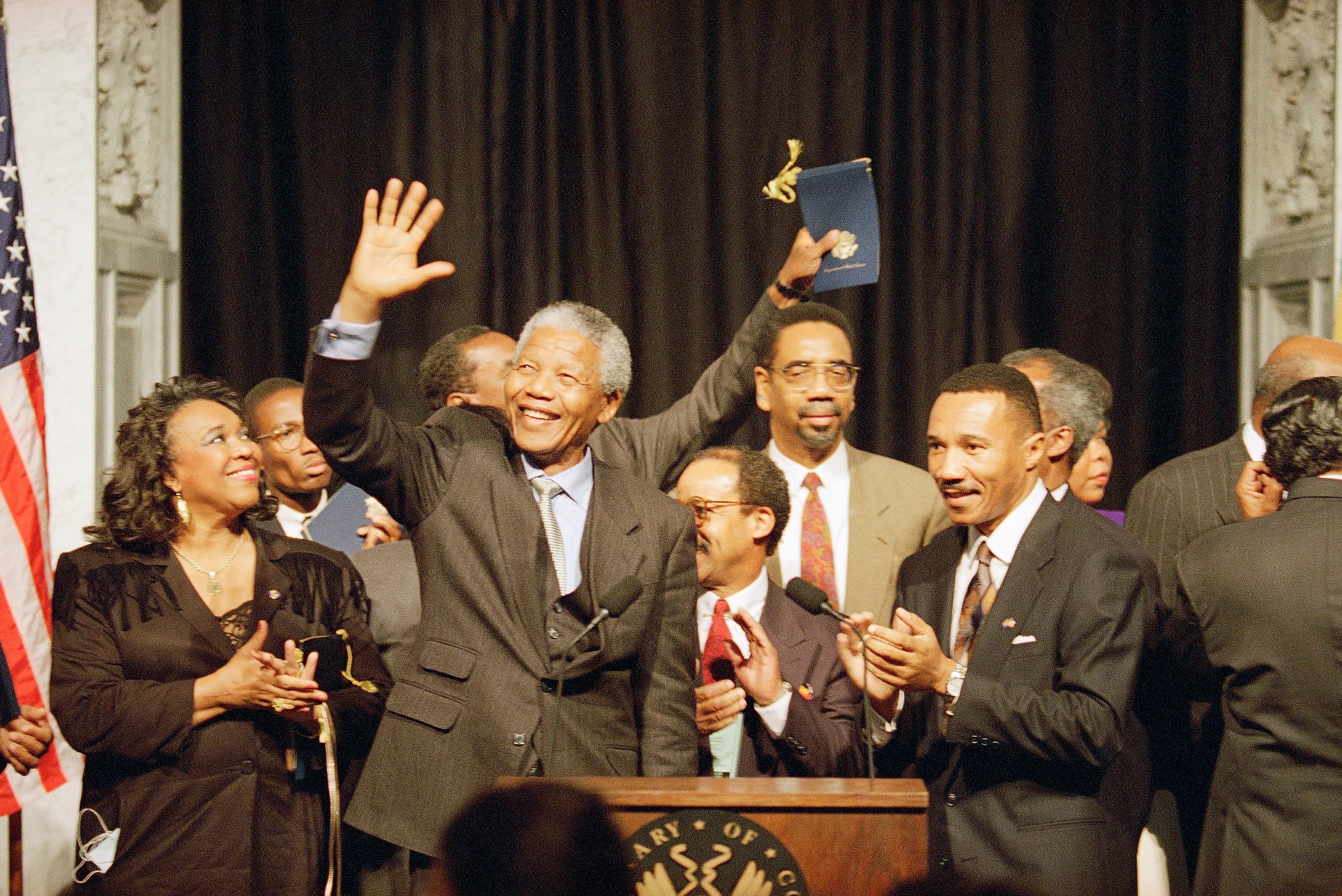 South African President Nelson Mandela gestures after a meeting with the Congressional Black Caucus on Oct. 4, 1994 on Capitol Hill, Washington. From left are Rep. Barbara-Rose Collins, D-Mich., Mandela, Rep. Bobby Rush, D-Ill., and Rep. Kweisi Mfume, D-Md., chairman of the caucus. Collins died at the age of 82, her family announced in a statement on Thursday, Nov. 4, 2021.