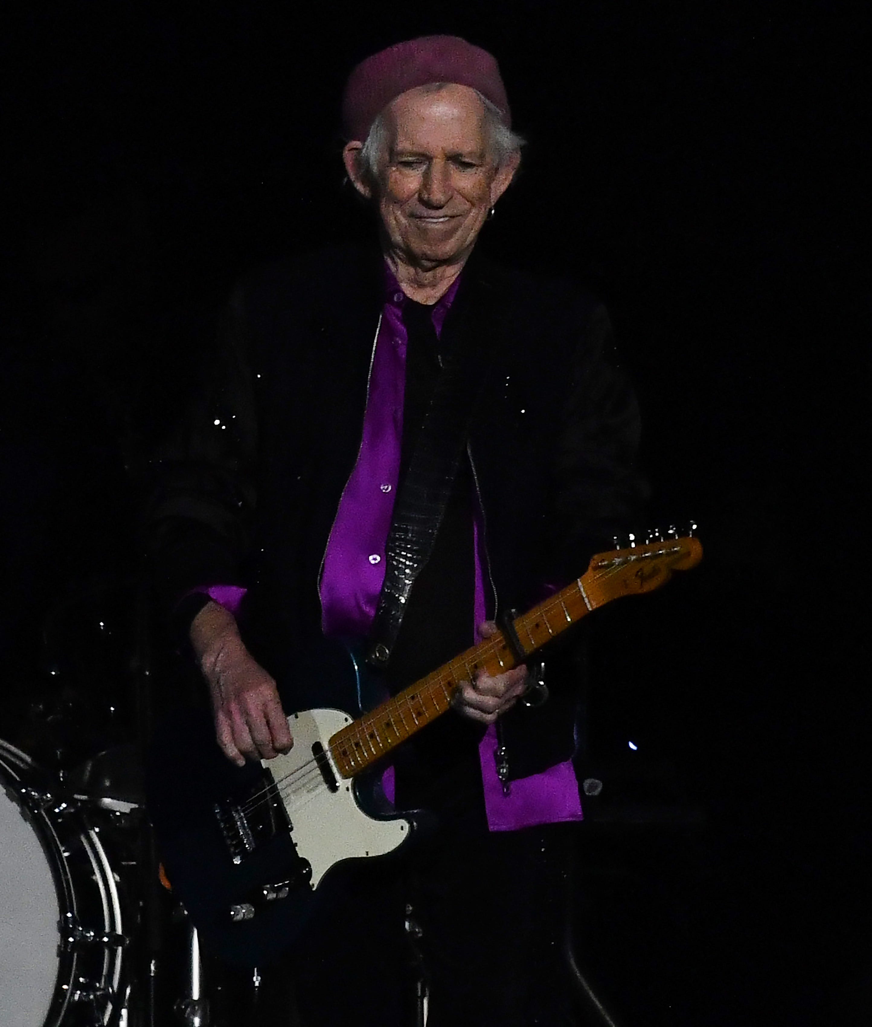 Guitarist Keith Richards smiles as The Rolling Stones take the stage at Ford Field in Detroit on Nov. 15, 2021.