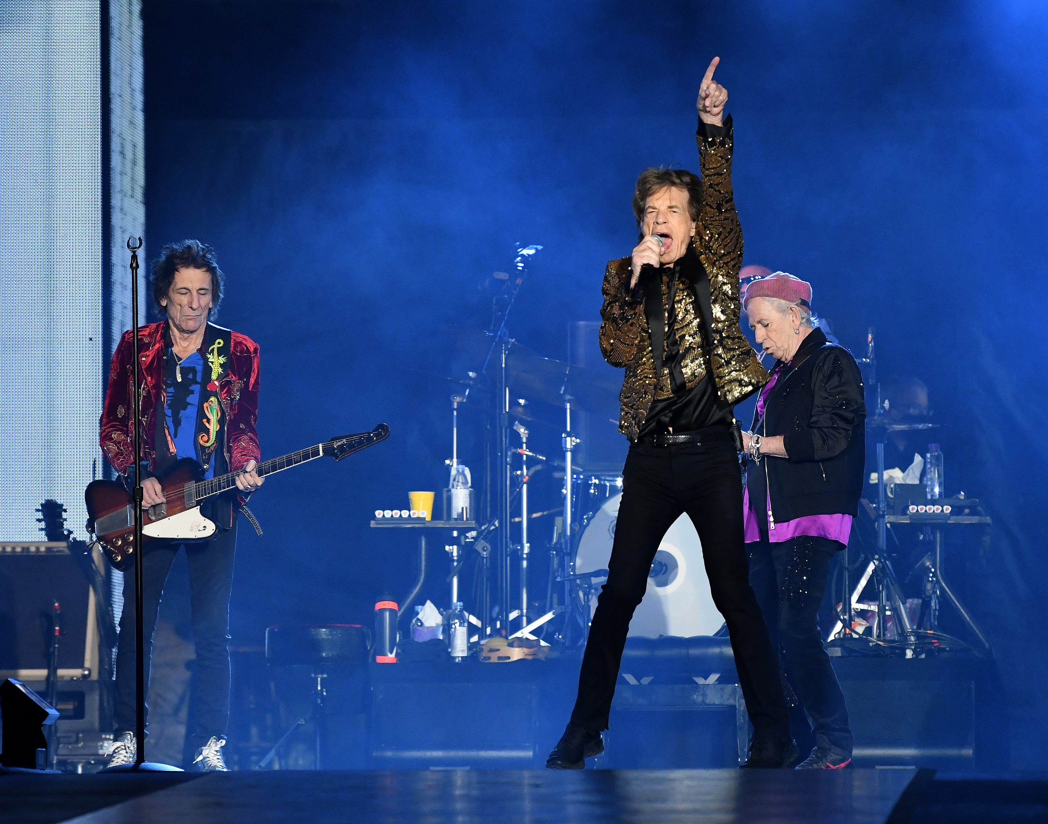 The Rolling Stones, from left, Ronnie Wood, Mick Jagger and Keith Richards take the stage at Ford Field.