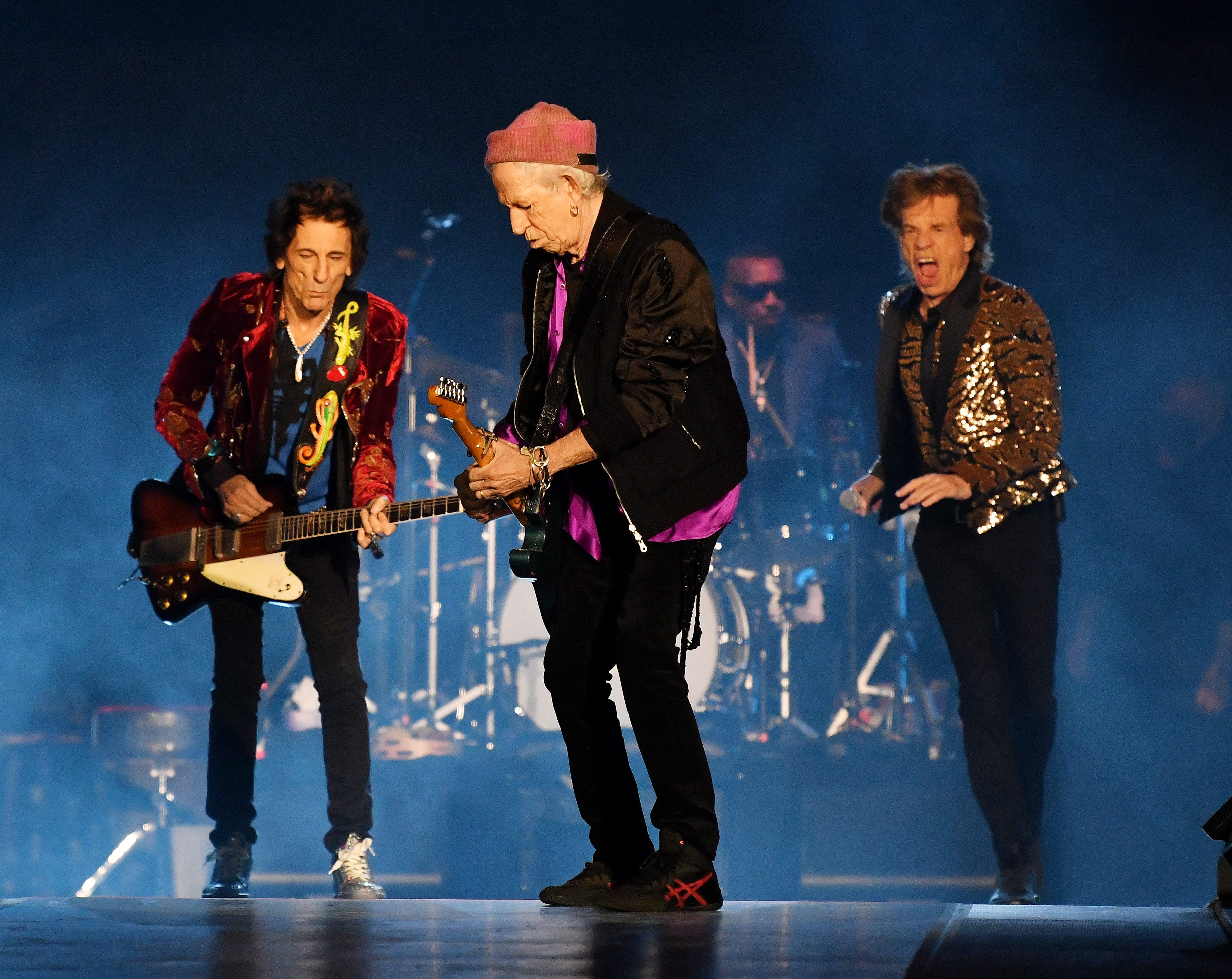 The Rolling Stones Ronnie Wood, left, Keith Richards, Mick Jagger and new drummer Steve Jordan take the stage at Ford Field in Detroit on Nov. 15, 2021.