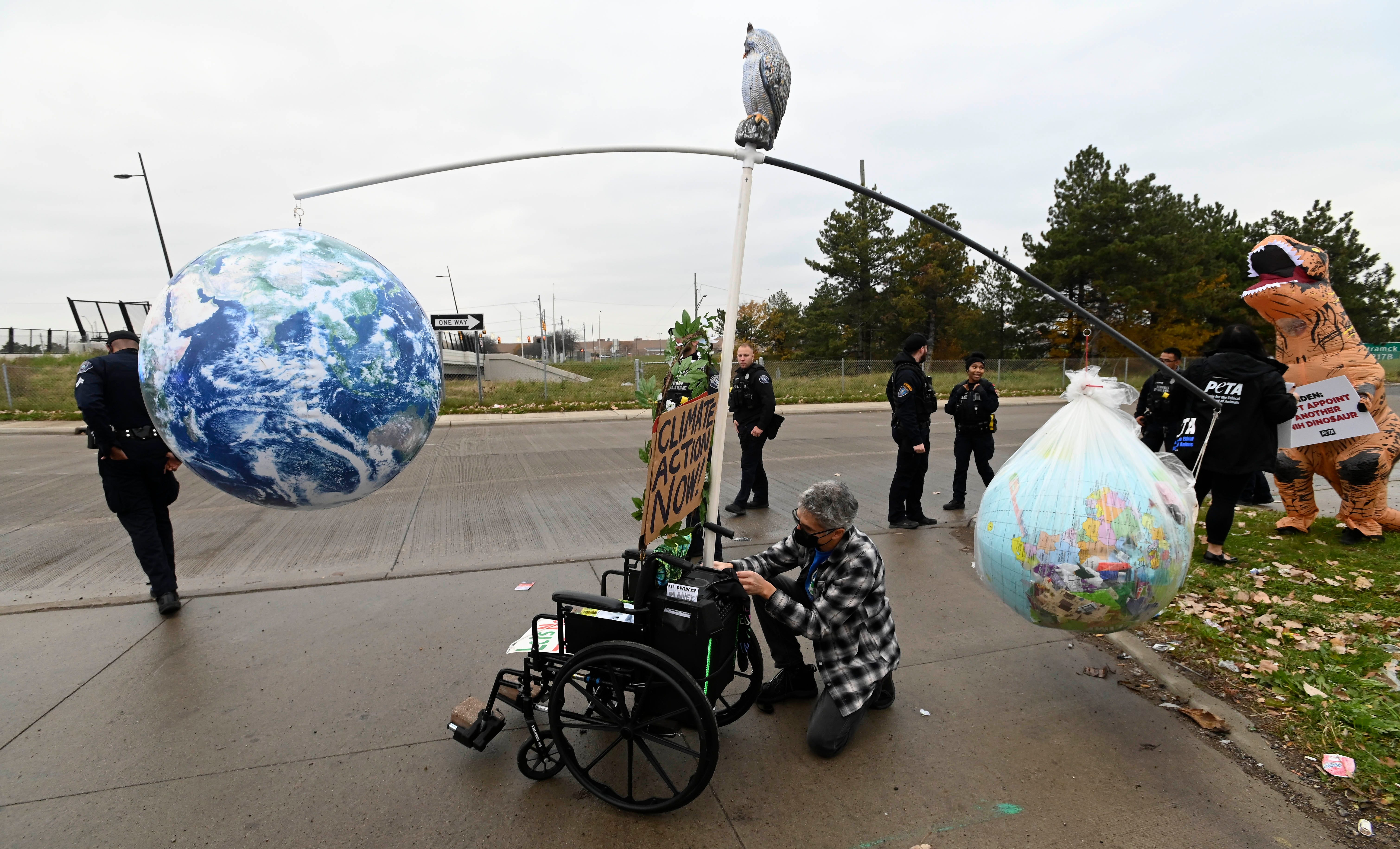Oil & Water Don't Mix Keep Oil Out of the Great Lakes member John Donabedian, of Livonia, put final touches on his Earthella Mobile display that represents the polarity of the natural world, left, and the man-made world, right, in the trash bag, Wednesday afternoon, November 17, 2021. 
Members of Oil & Water Don't Mix Keep Oil Out of the Great Lakes and others protest Enbridge's twin Line 5 oil pipelines in the Straits of Mackinac before President Joe Biden tours the GM Factory ZERO in Detroit.