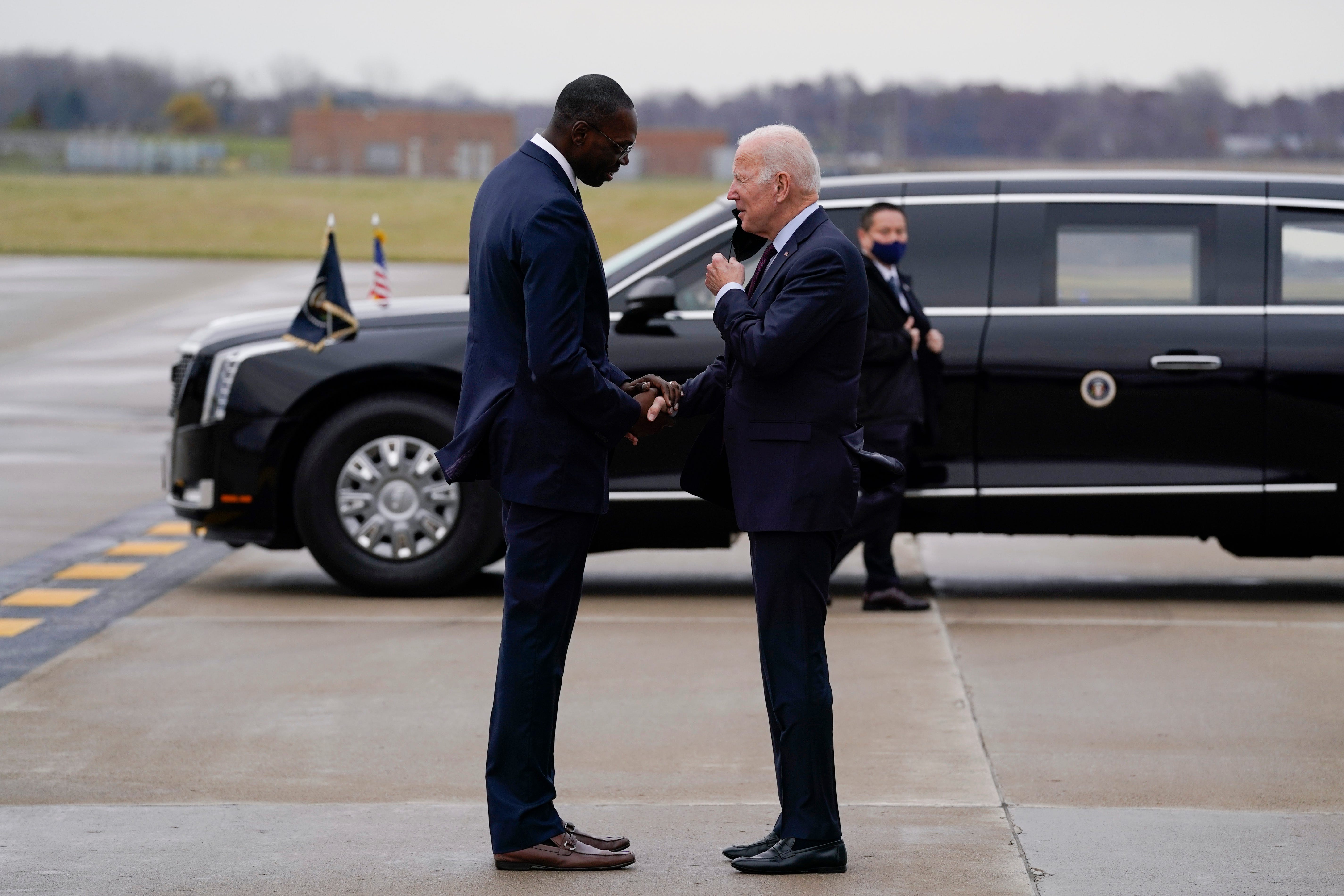 Michigan Lt. Gov. Garlin Gilchrist II greets President Joe Biden as he arrives at Detroit Metropolitan Wayne County Airport, Wednesday, Nov. 17, 2021, in Detroit.