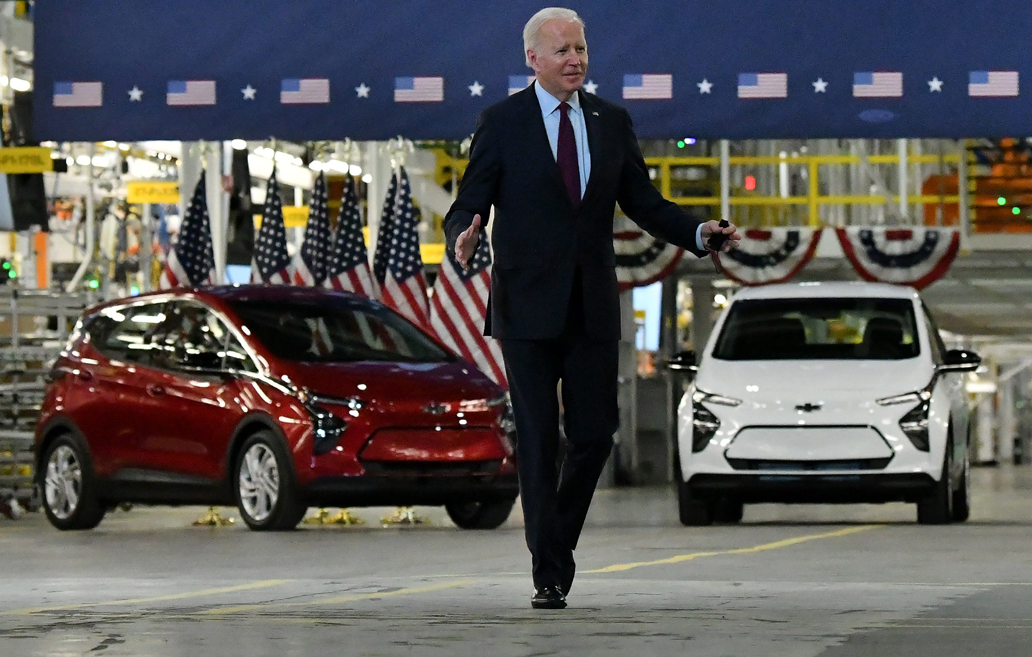 With GM Bolts in the background, President Joe Biden walks towards the podium to speak.