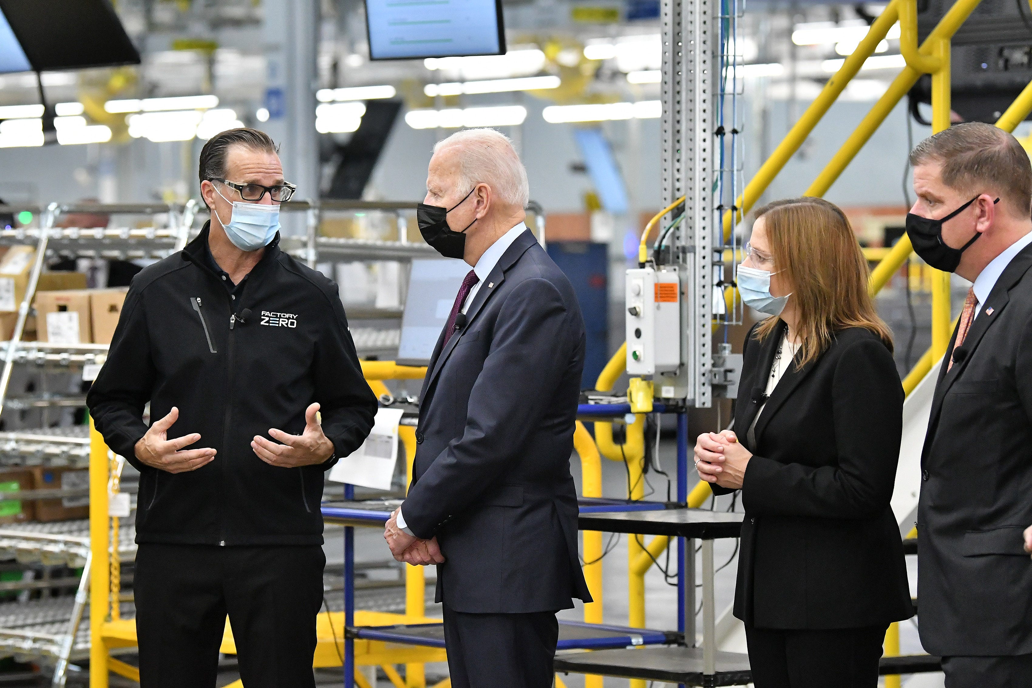 General Motors Factory ZERO plant director Jim Quick talks about the Hummer EV electrical validation area with President Joe Biden, GM CEO Mary Barra and U.S. Labor Secretary Marty Walsh.