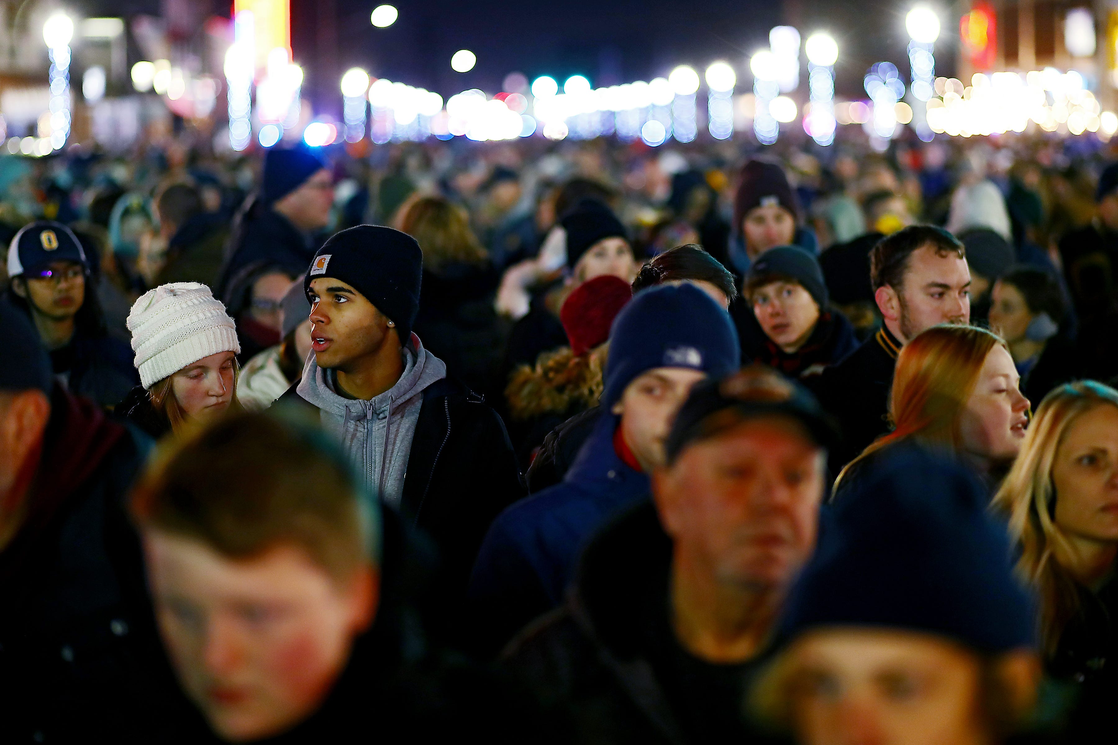 Thousands of people from around metro Detroit gathered in downtown Oxford for a candlelight vigil on Friday, Dec. 3, 2021.