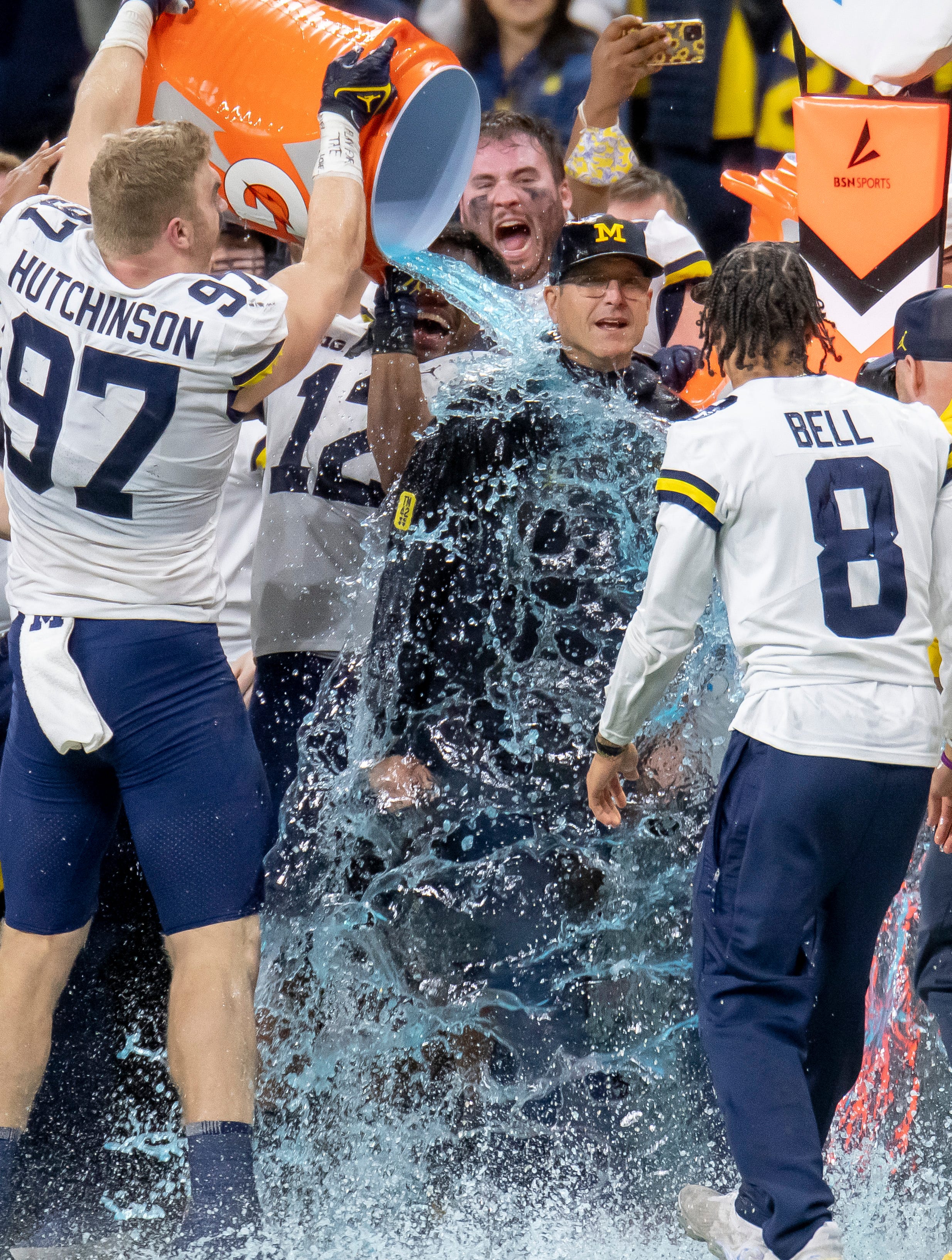 Michigan defensive end Aidan Hutchinson pours Gatorade on top of head coach Jim Harbaugh in the final moment of the fourth quarter.