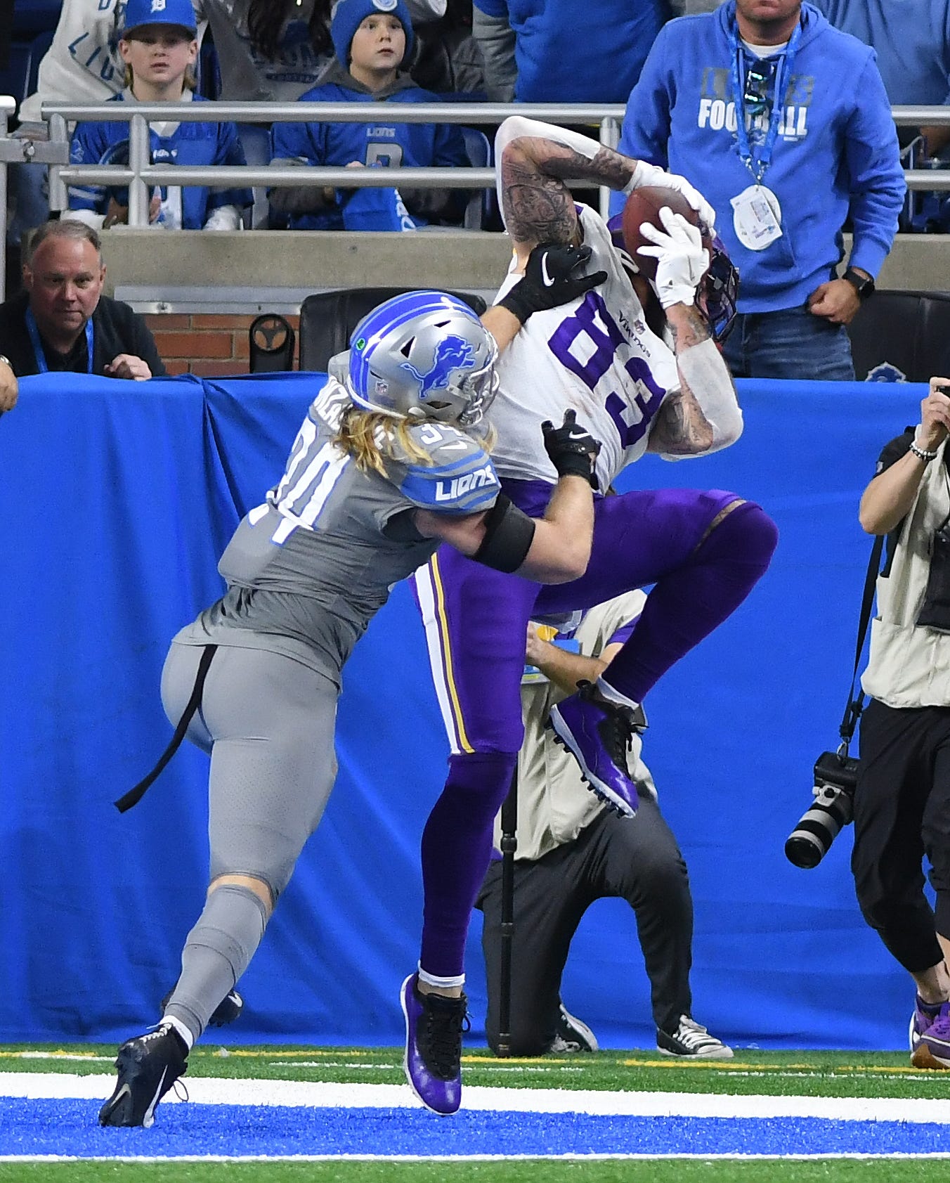 Lions' Alex Anzalone defends against Vikings' Tyler Conklin, who can't get both feet down in the end zone, denying a touchdown in the third quarter.