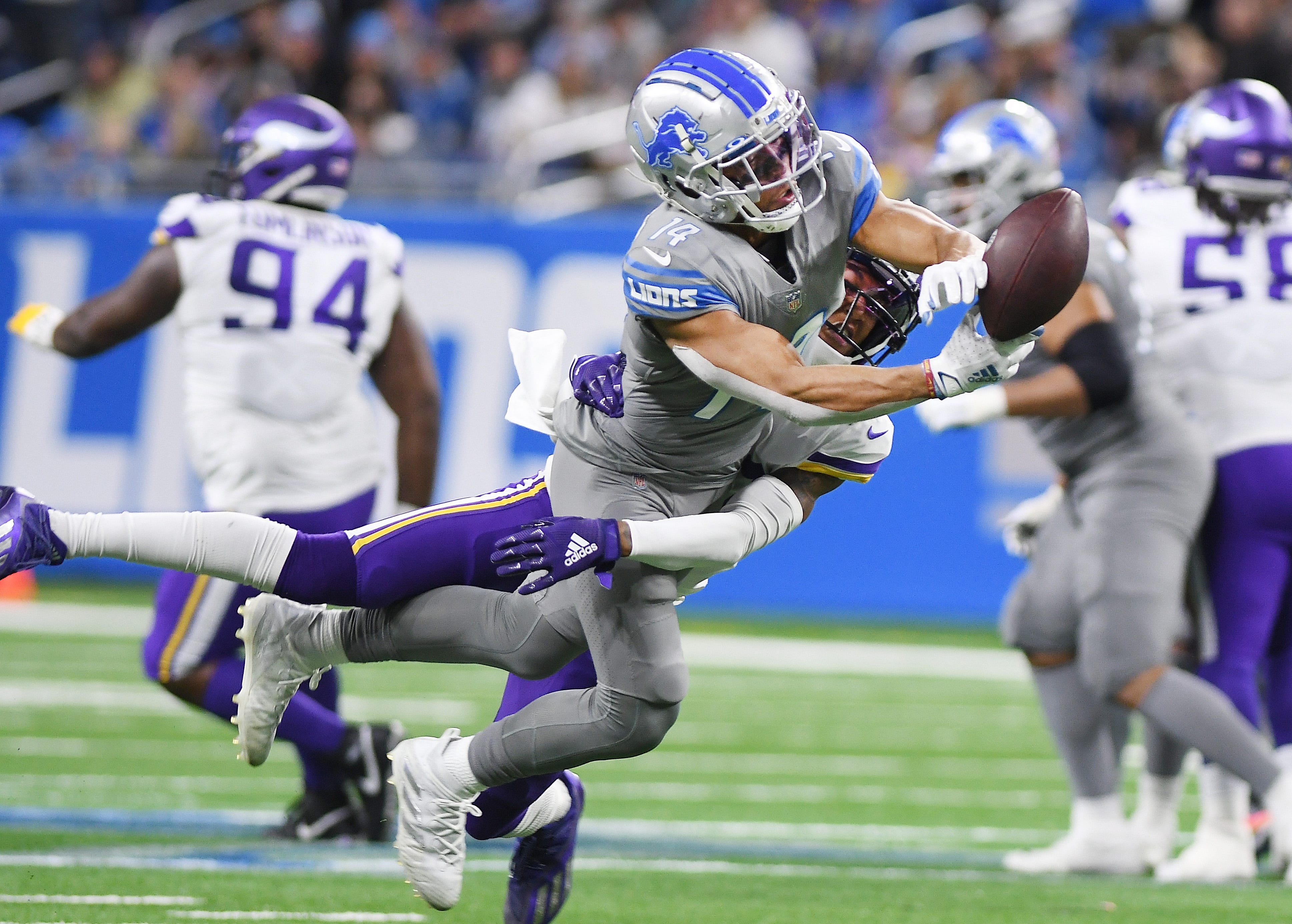 Lions wide receiver Amon-Ra St. Brown can't pull in a reception with Vikings' Cameron Dantzler defending in the fourth quarter.