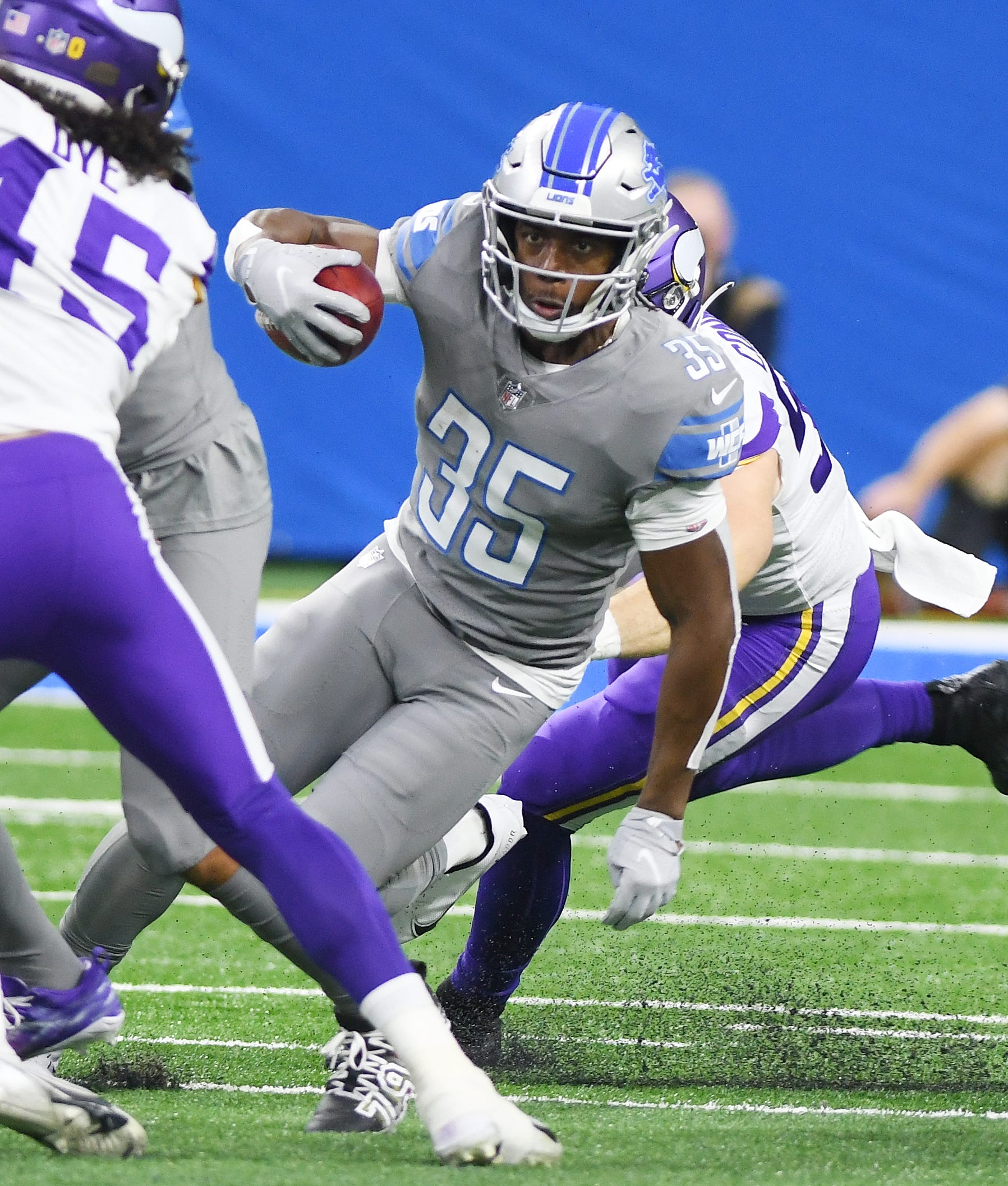 Lions running back Godwin Igwebuike heads up field on a run in the fist quarter Sunday against the Vikings.