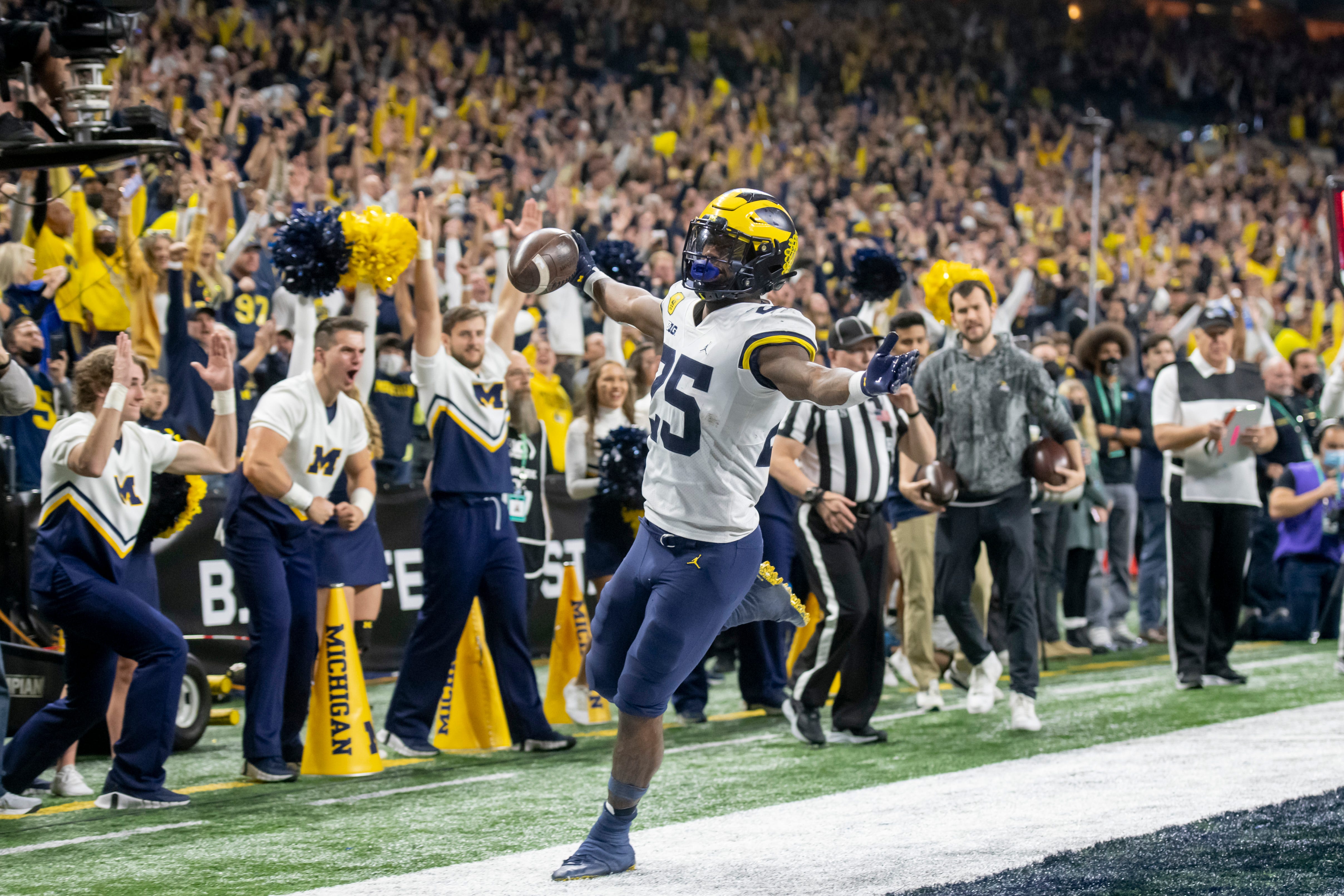 Michigan running back Hassan Haskins celebrates after scoring a touchdown during the third quarter.