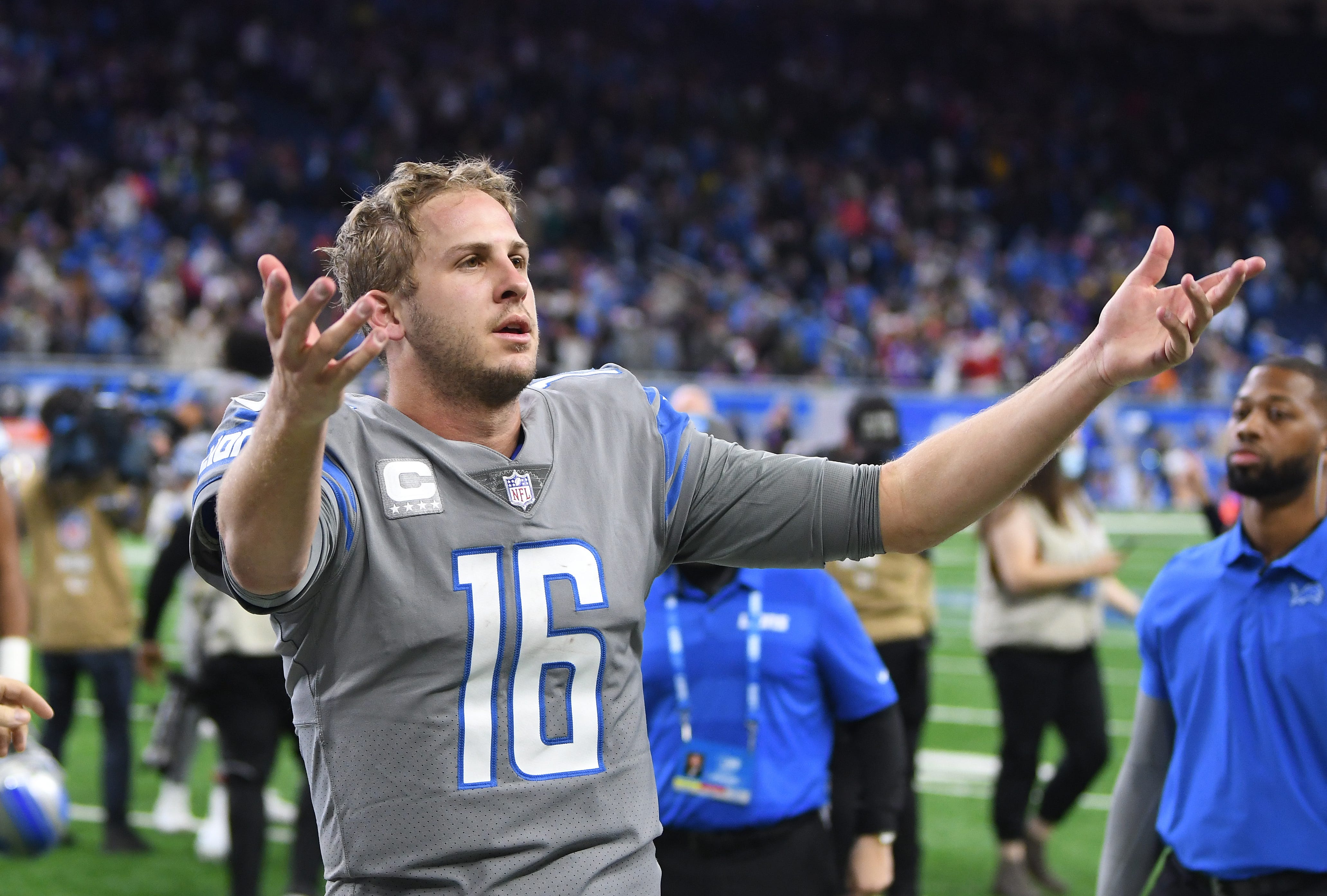 Lions quarterback Jared Goff leaves the field to the cheers of fans after throwing the game winning touchdown, with no time left on the clock, for Detroit's first victory of the season.
