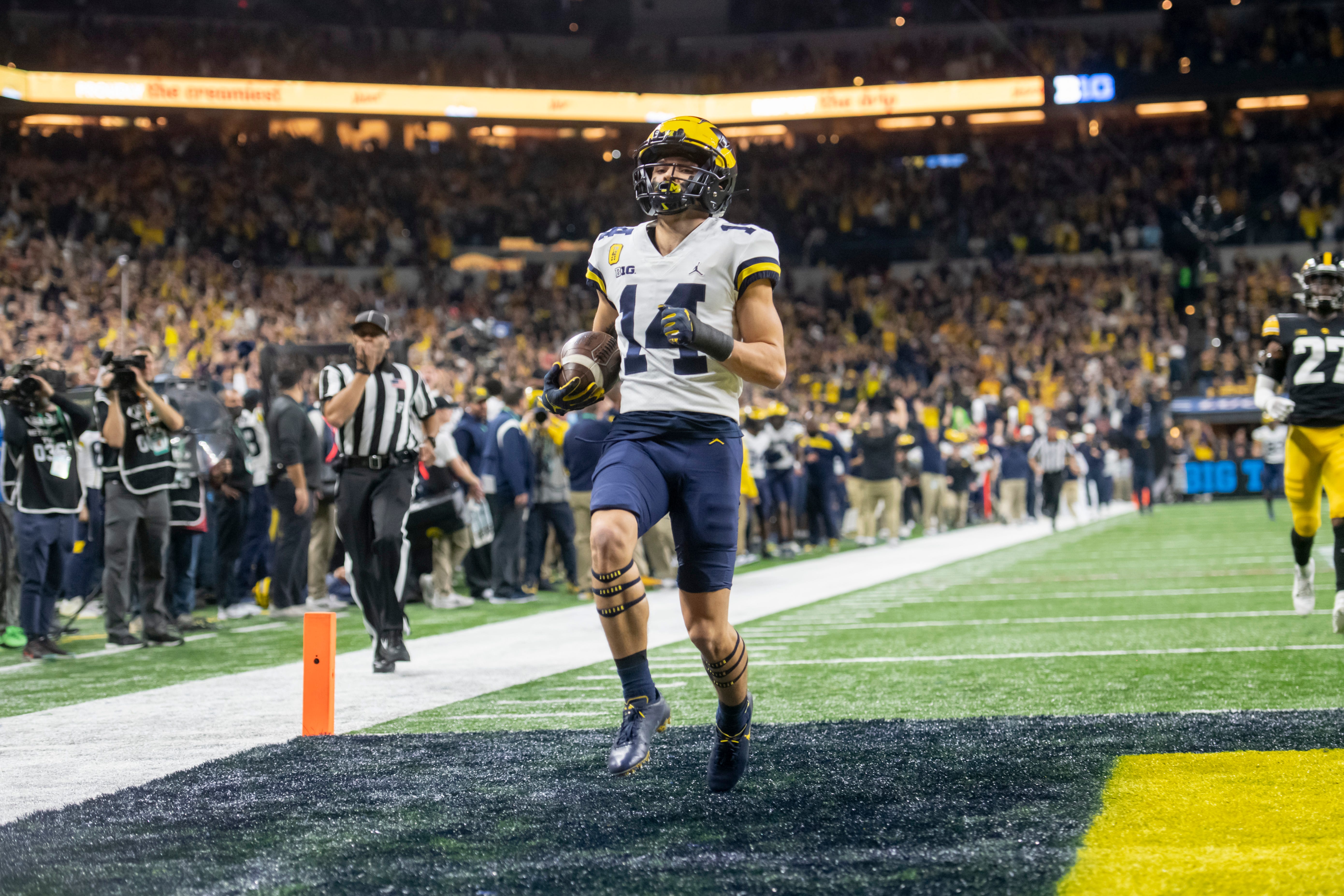 Michigan wide receiver Roman Wilson celebrates after catching a pass for a touchdown during the first quarter.