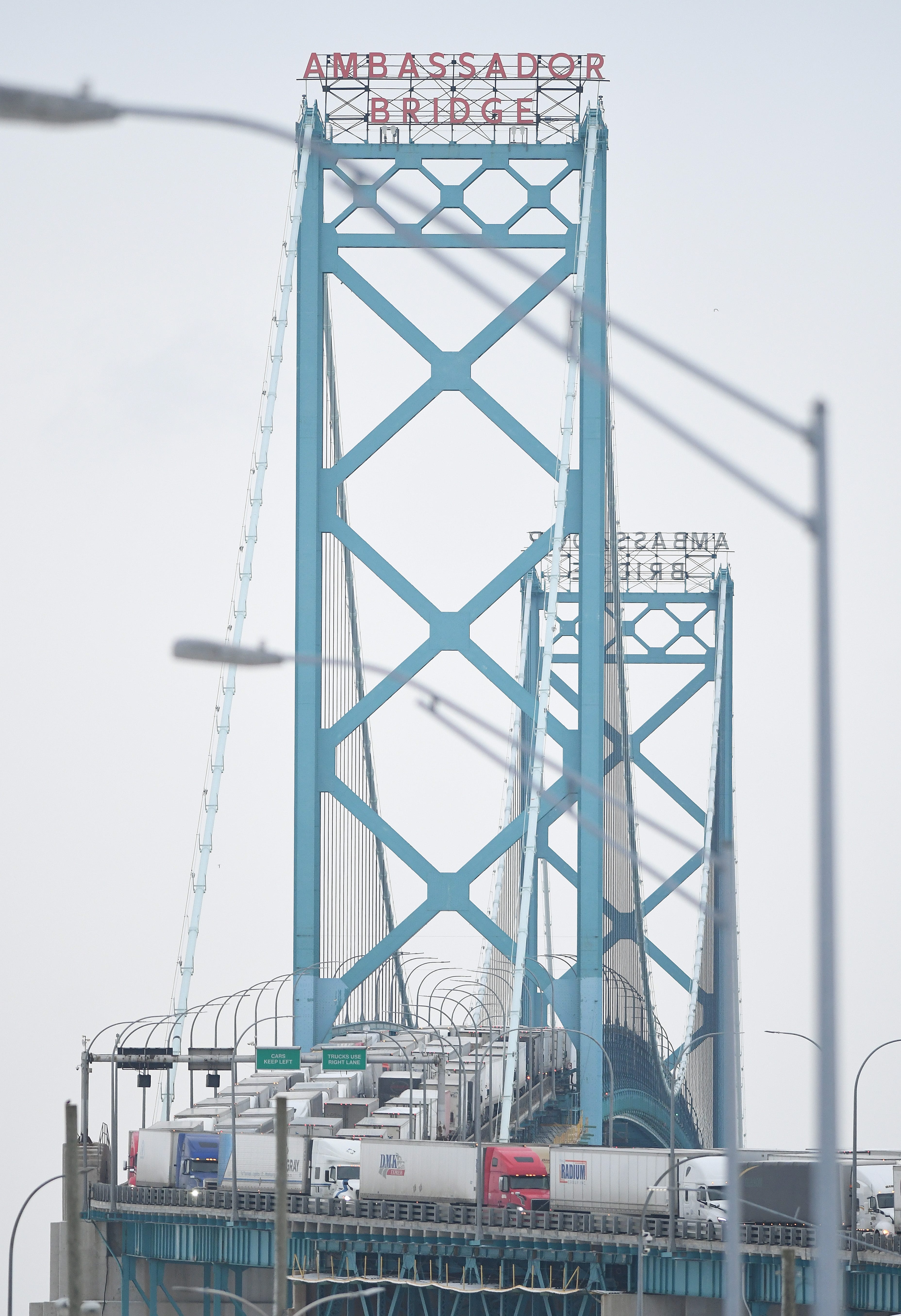 Trucks backed up heading to and from Canada on the Ambassador Bridge, due to protests on the Windsor side, in Detroit, Michigan on February 7, 2022.