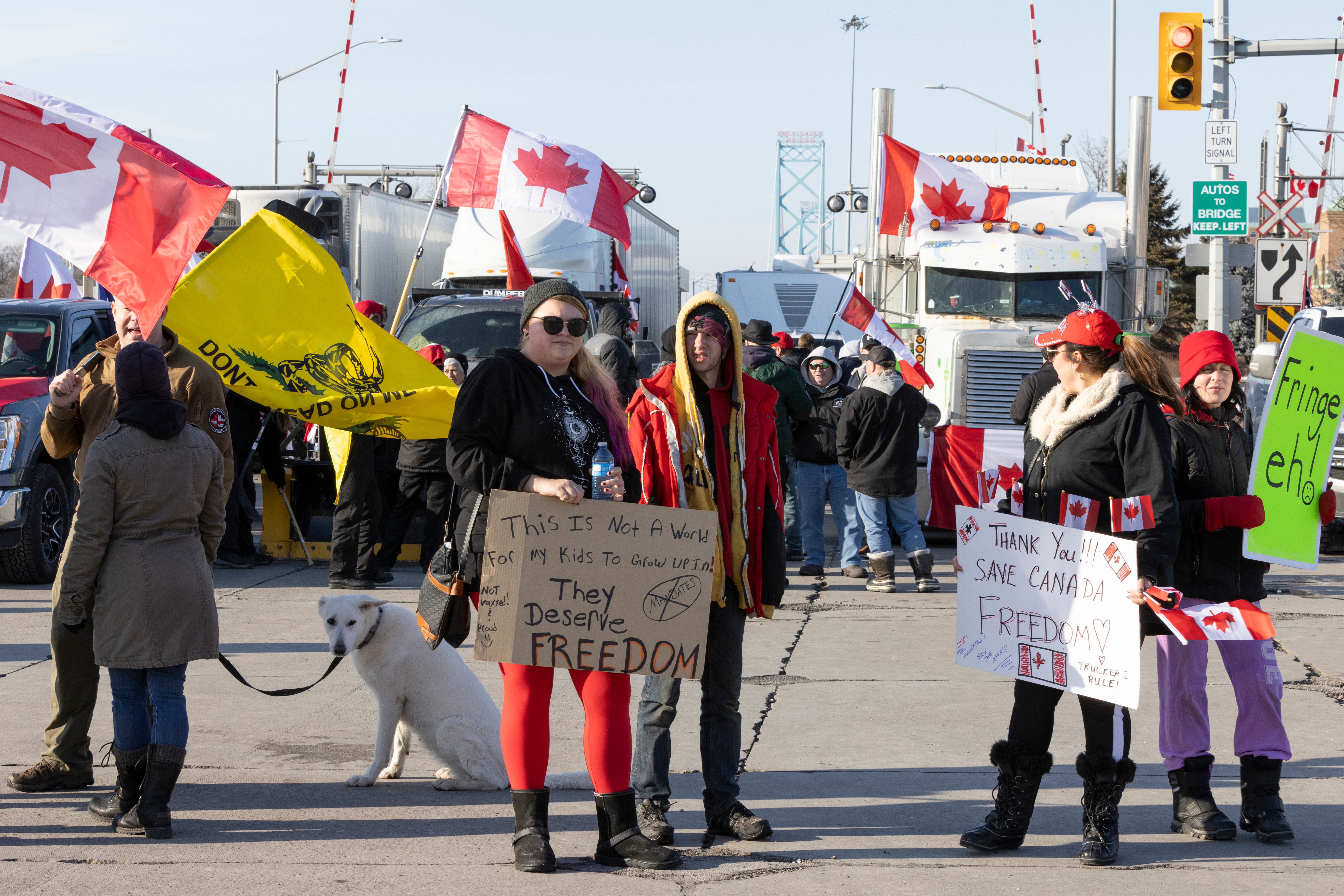 Protestors block traffic at the Ambassador Bridge, linking Windsor, Ontario and Detroit on Wednesday, Feb. 9, 2022. The demonstration in solidarity with protests in Ottawa against COVID-19 restrictions has blocked traffic into Canada on the Ambassador Bridge linking Windsor and Detroit since Monday and is the the single busiest commercial crossing in North America. (