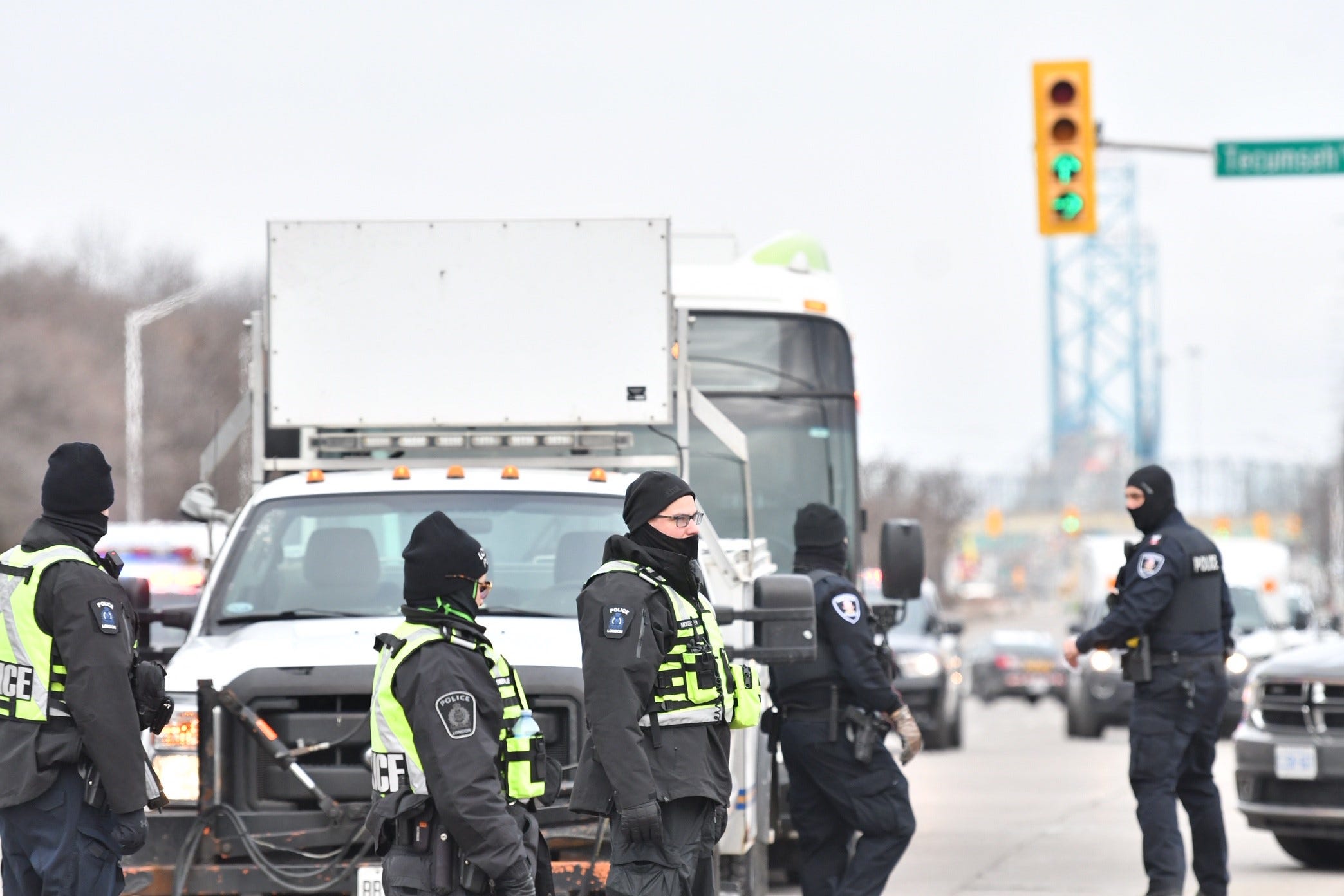 Canadian police assemble near the Ambassador Bridge on Sunday morning.