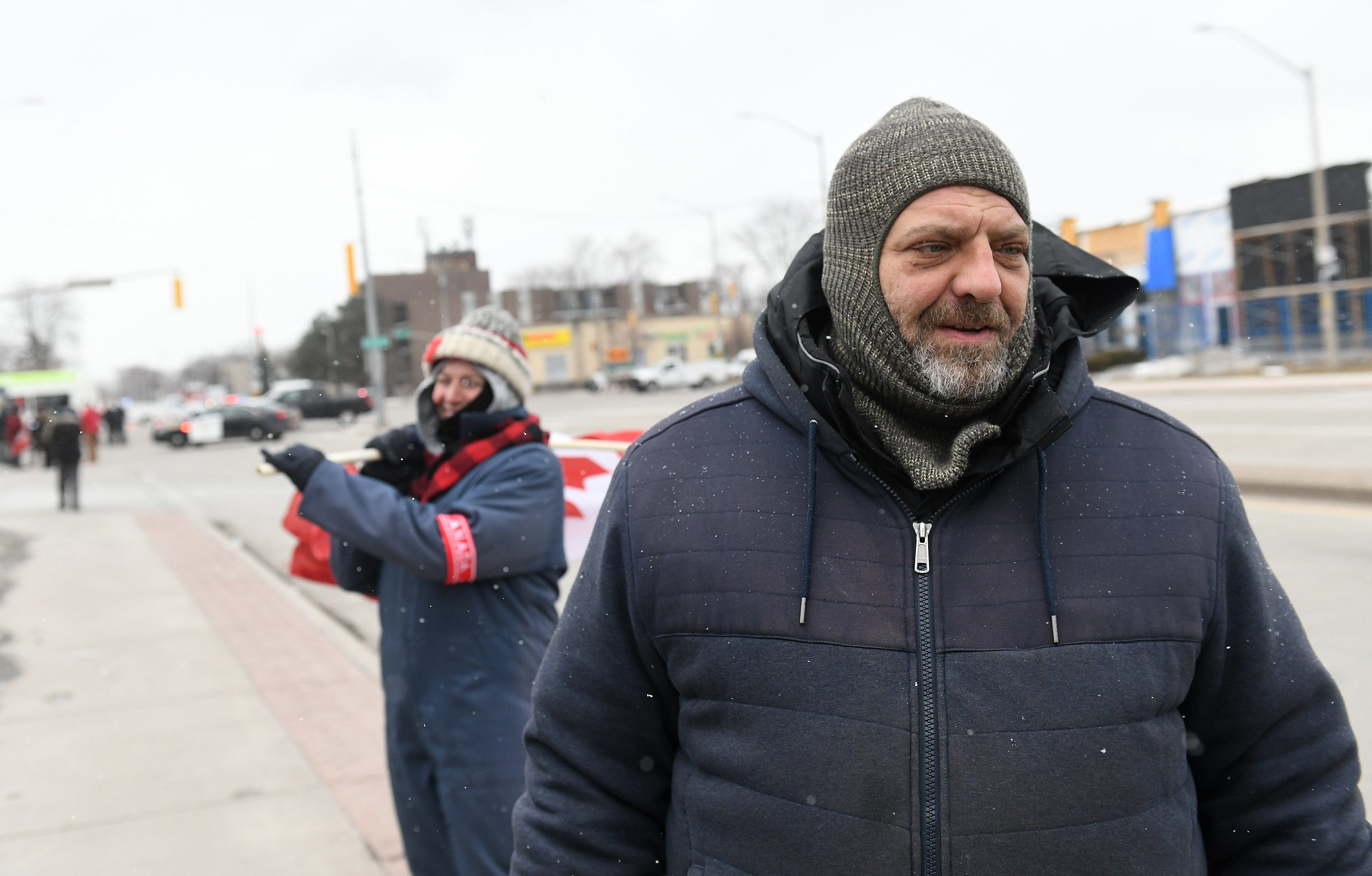 Richard Drouillard, 40, of Windsor talks about being out to protest COVID vaccination mandates by the Canadian government in Windsor, Ontario, on Feb. 13, 2022.  
(Robin Buckson / The Detroit News)