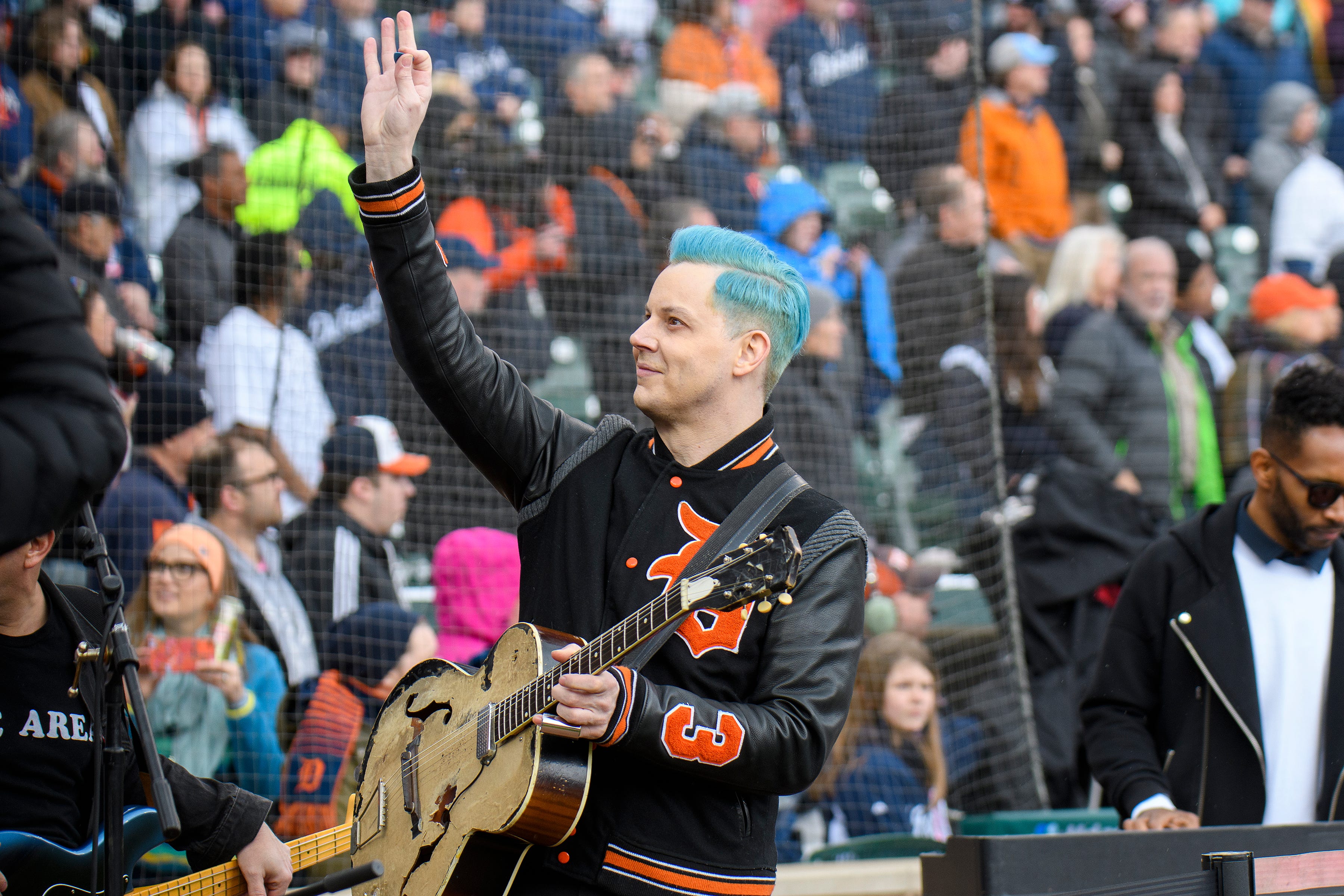 Detroit native Jack White waves to fans during Opening Day festivities for the Detroit Tigers at Comerica Park, Friday, April 8, 2022 in Detroit.