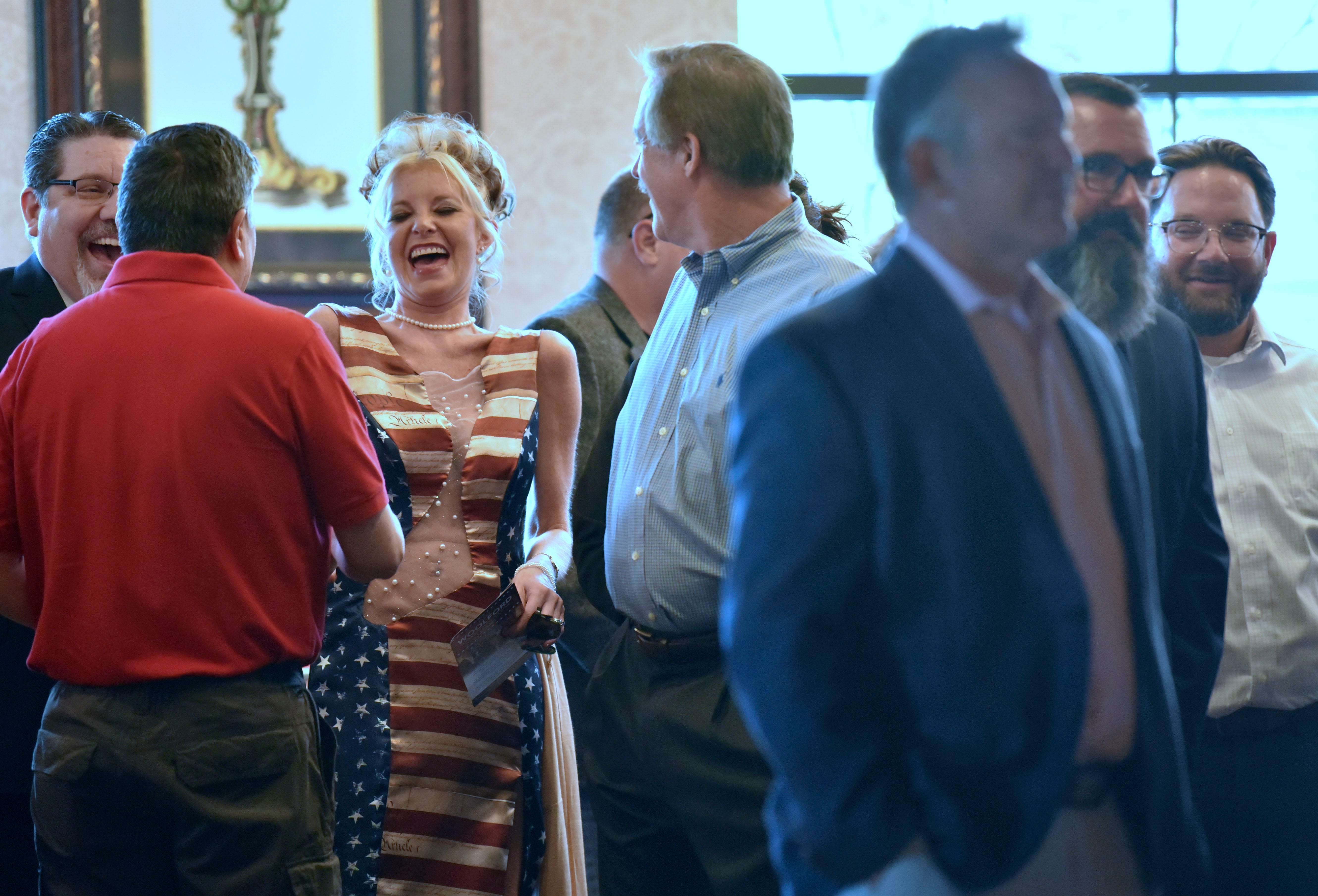 2APatroit.org co-founder (in Michigan) Anna-Marie Rodriguez-Pelizzari, third from right, of Brighton, shares a laugh with other before the debate begins, Thursday, May 12, 2022. 
The Livingston County Republican Party's 2022 Lincoln Day Dinner features the First Official GOP Gubernatorial Debate at Crystal Gardens Event and Banquet Center in Howell, Thursday night, May 12, 2022.