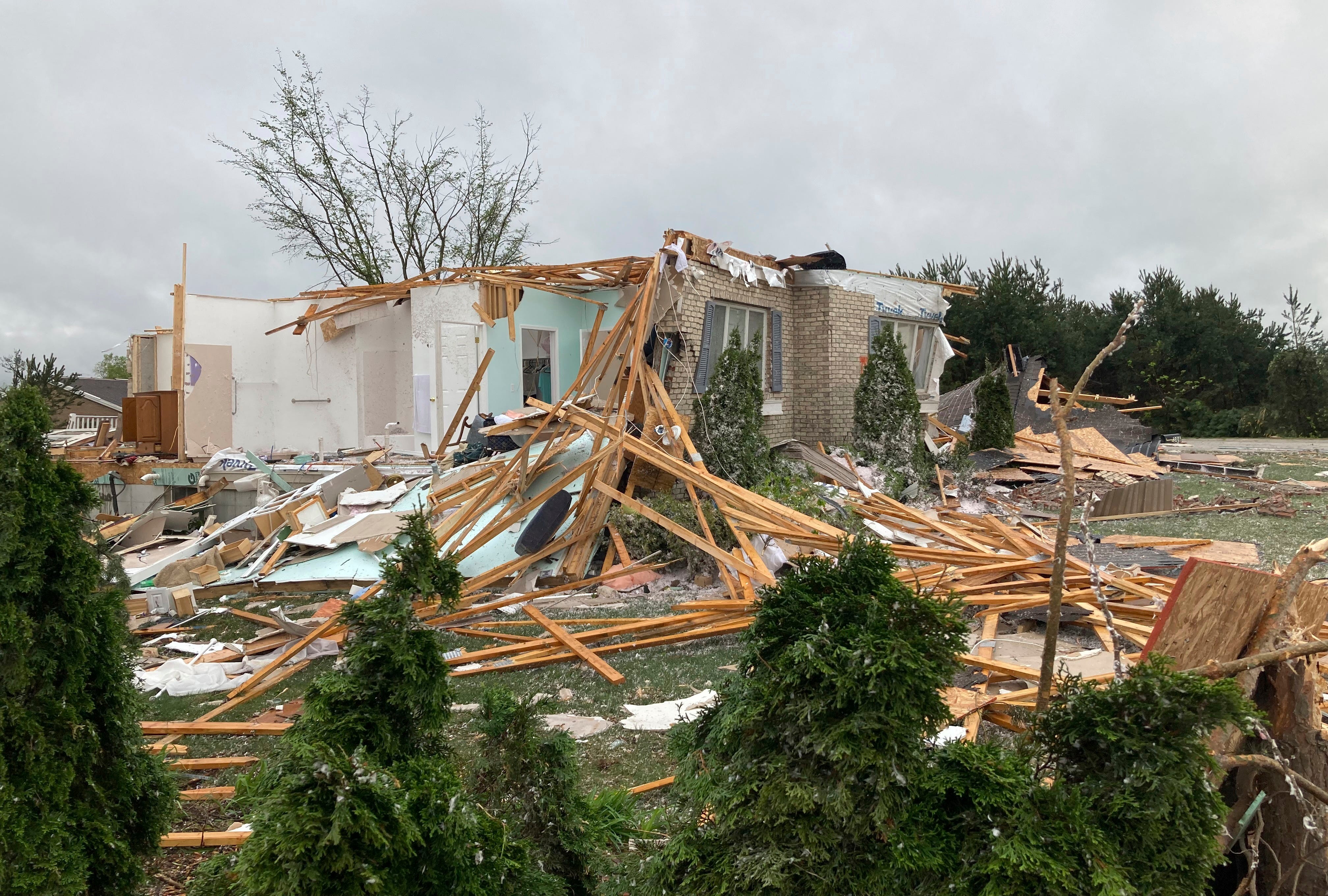 Damage is seen at a home after a tornado came through the area in Gaylord, Mich., Friday, May 20, 2022.