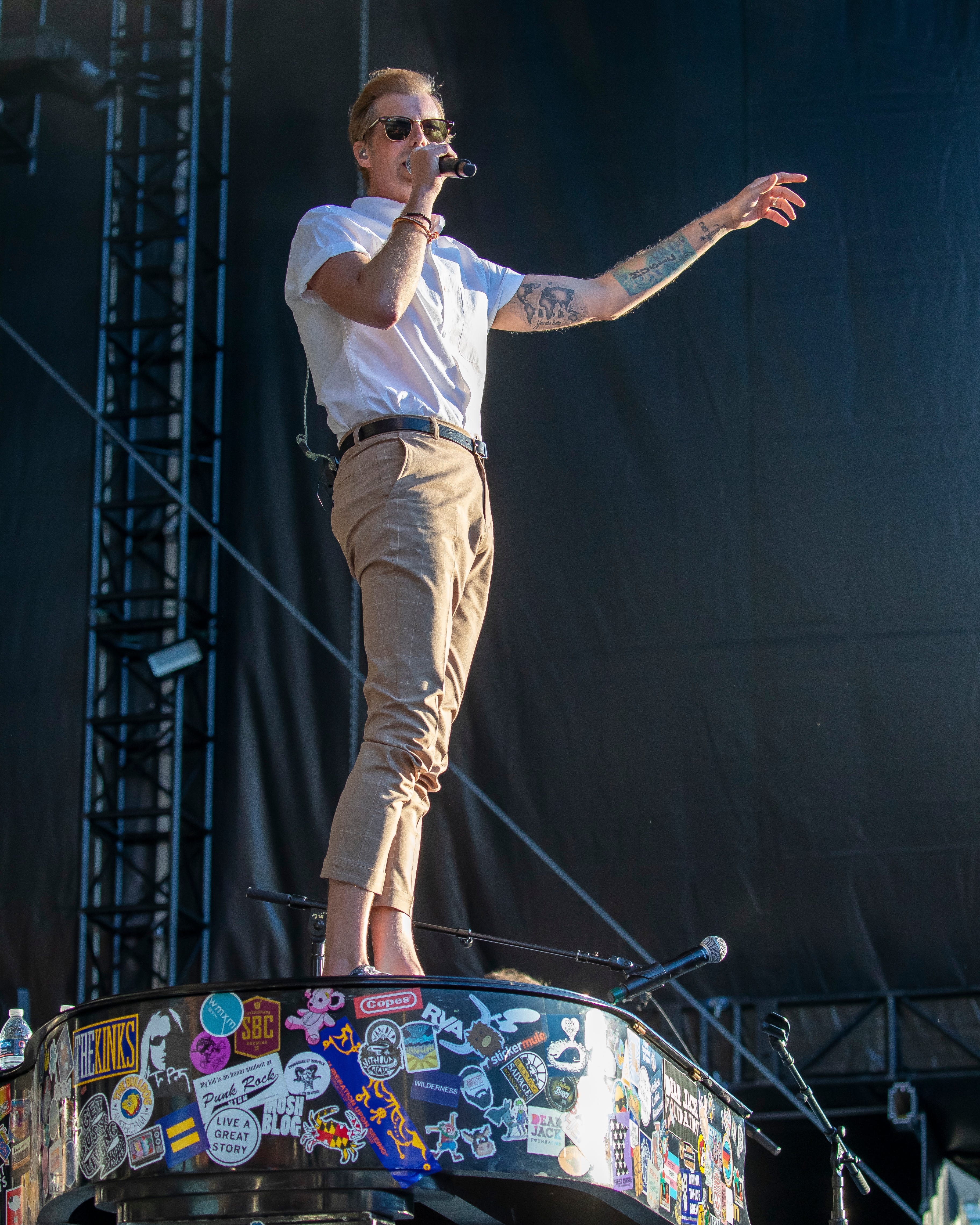 Andrew McMahon stand on top of his piano while performs at Comerica Park.