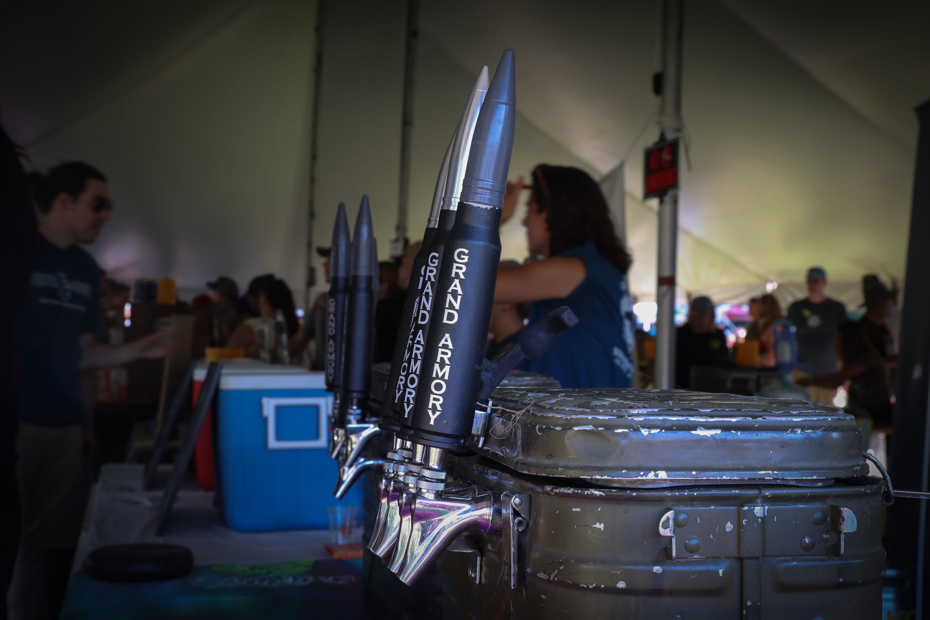 A close-up look at the military-themed beer tap handles at the stand of Grand Armory Brewing at the Michigan Brewers Guild Summer Beer Festival on Friday, July 22, 2022.