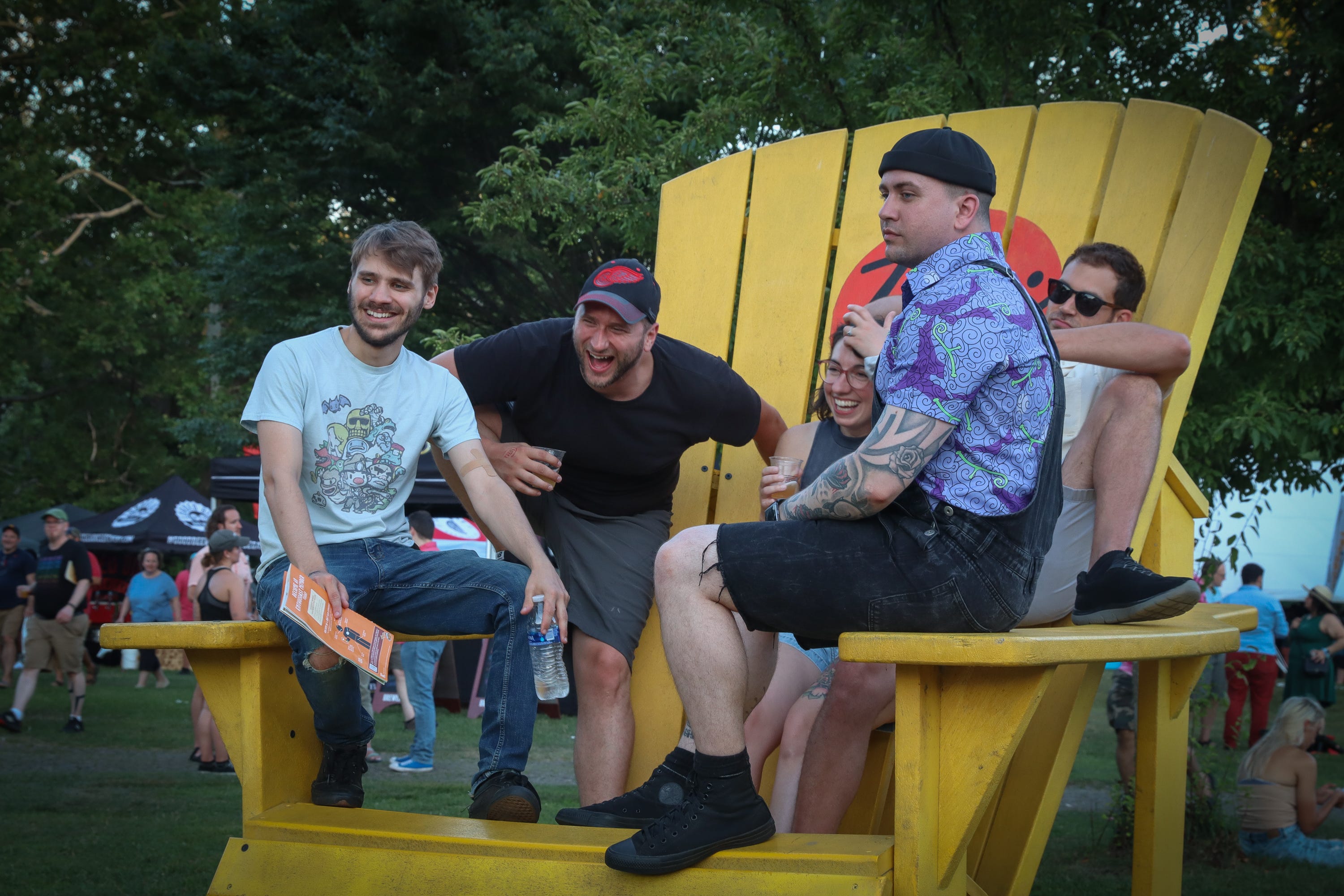 Left to right, Keith Appel, Zac Whalen, Jordan Szpond, David Bladecki, and Nick Szpond pose for a picture on a giant Adirondack chair in Riverside Park at the Summer Beer Festival. All but Bladecki are from Ypsilanti. Bladecki is from Benton Harbor.