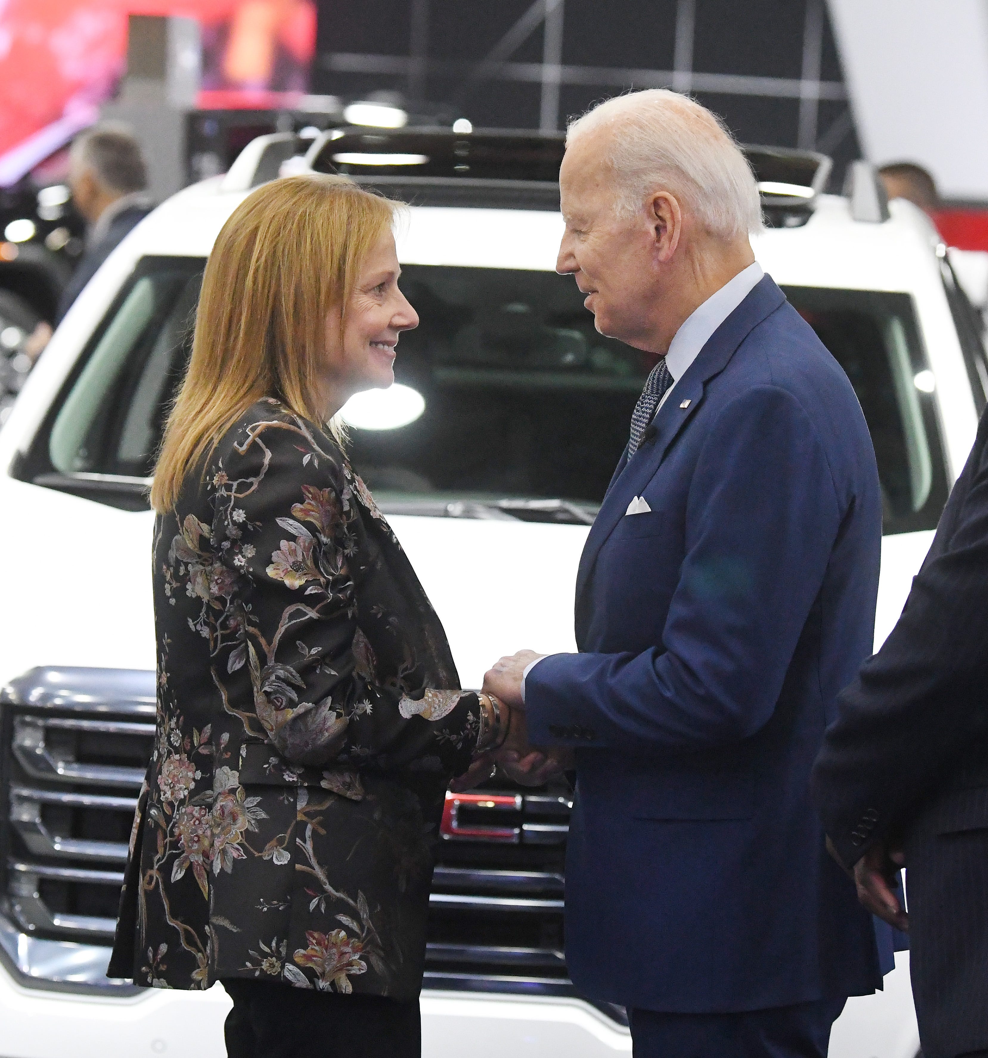 General Motors chair and chief executive officer Mary Barra greets President Joe Biden at the GM display during a tour of the 2022 North American International Auto Show in Detroit, Michigan on September 14, 2022.
