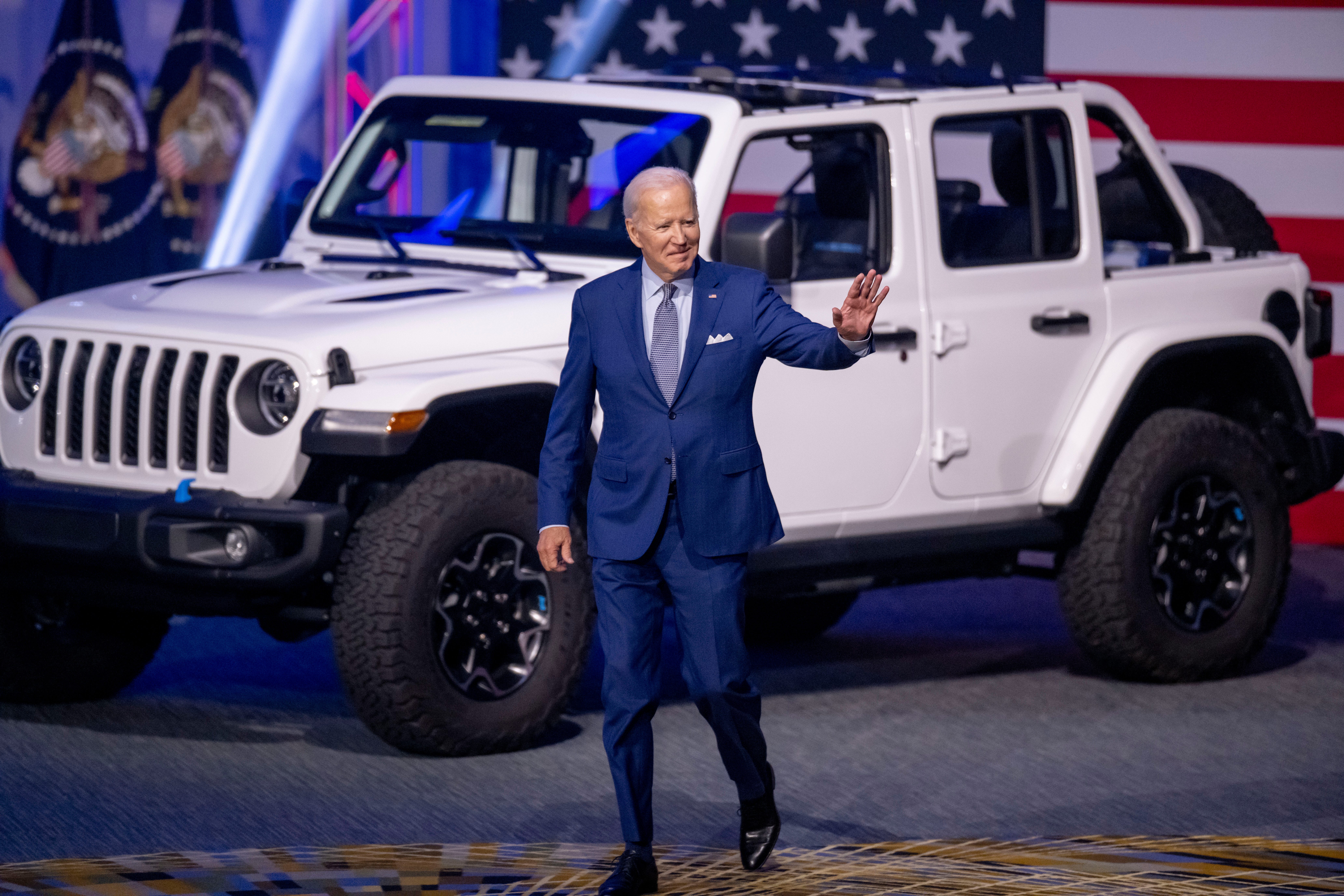 President Joe Biden comes out onto the stage for a speech while visiting the North American International Auto Show at Huntington Place, in Detroit, September 14, 2022.