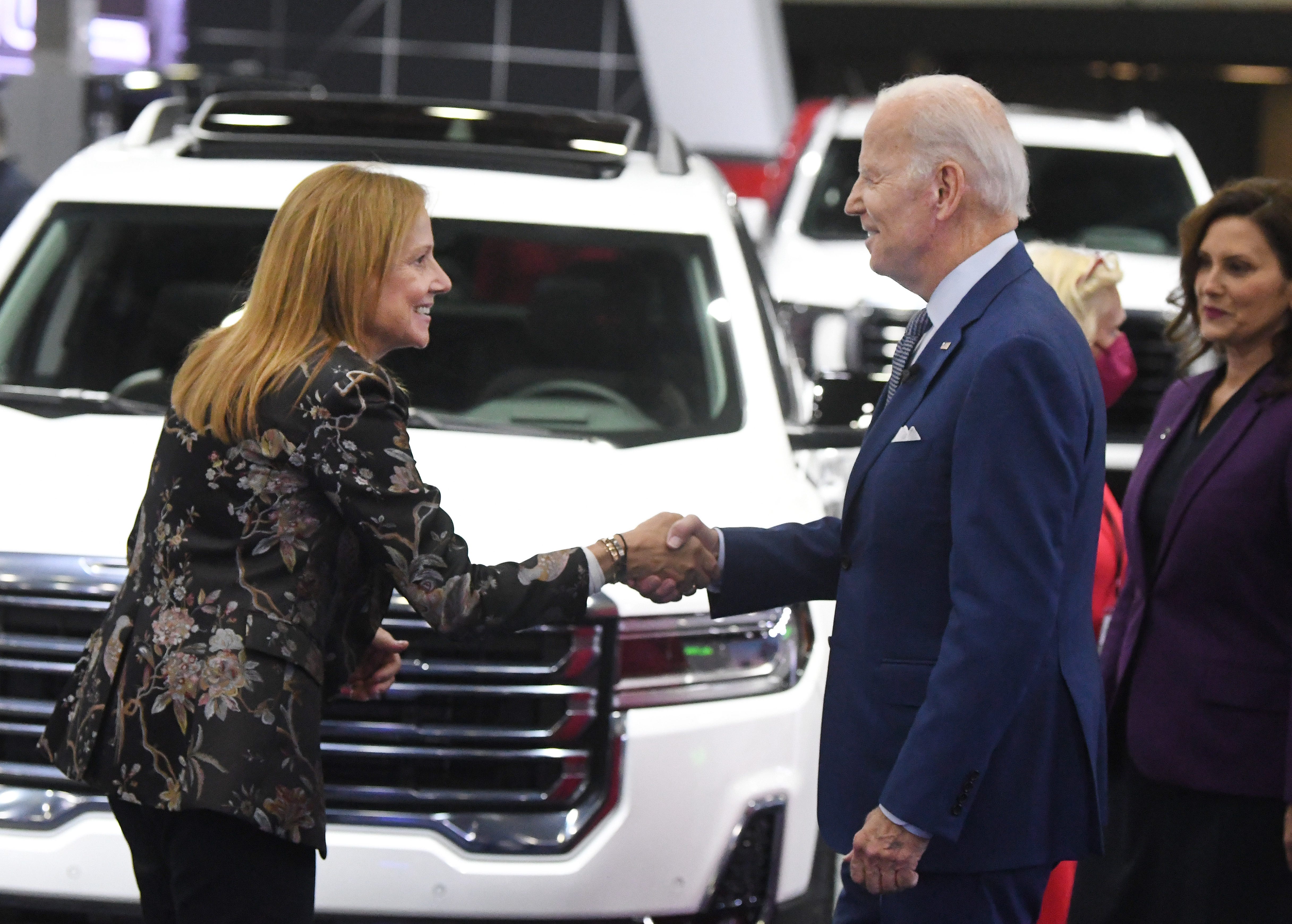 General Motors chair and chief executive officer Mary Barra greets President Joe Biden at the GM display during a tour of the 2022 North American International Auto Show in Detroit, Michigan on September 14, 2022.  =