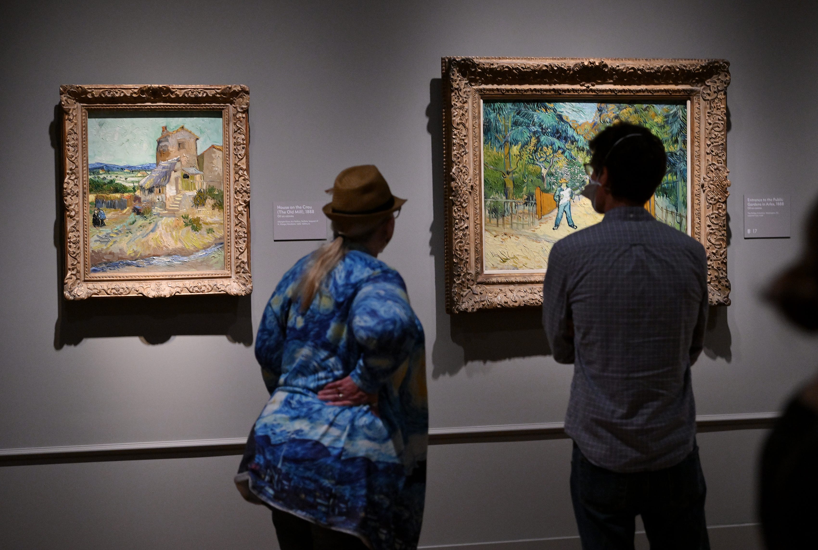 From left, Mary Kethman and Finn Rosbury both of Detroit look at paintings at the Van Gogh exhibit at the Detroit Institute of Arts in Detroit on Oct. 2, 2022.
