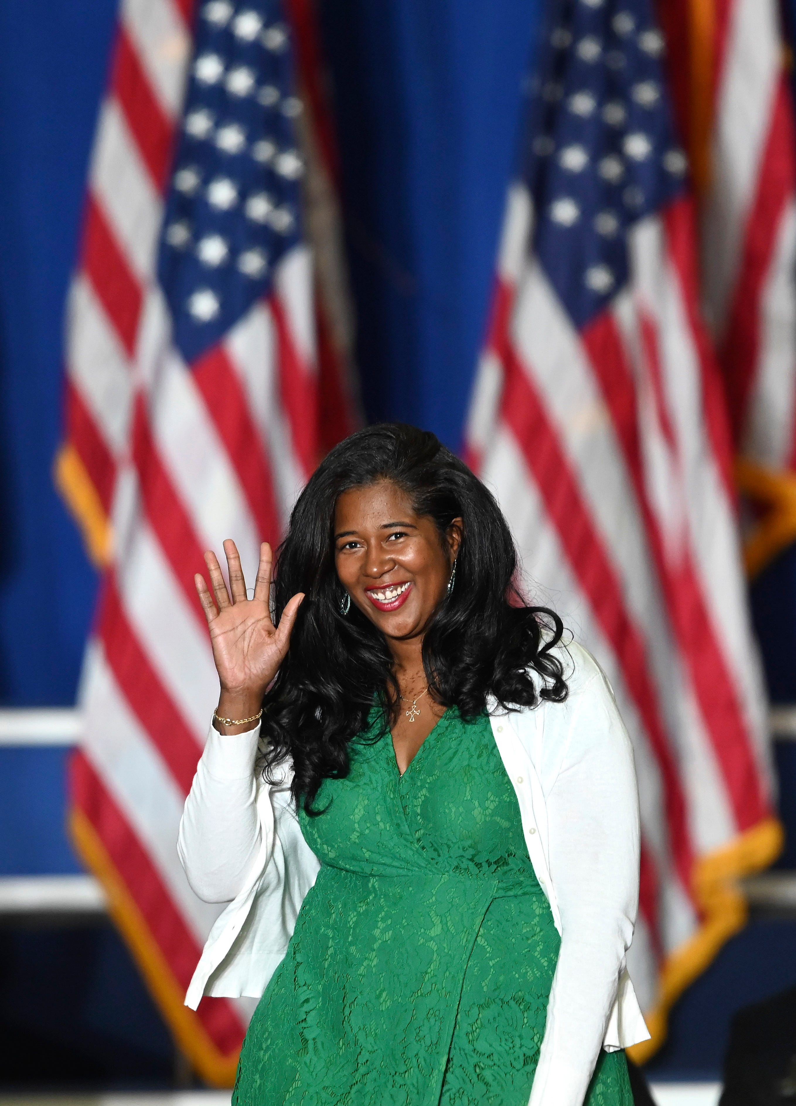 MI Secretary of State Republican candidate Kristina Karamo waves to the crowd on her way to the podium, at a Donald Trump rally at the Macomb Community College Sports & Expo Center in Warren, Saturday, October 1, 2022.