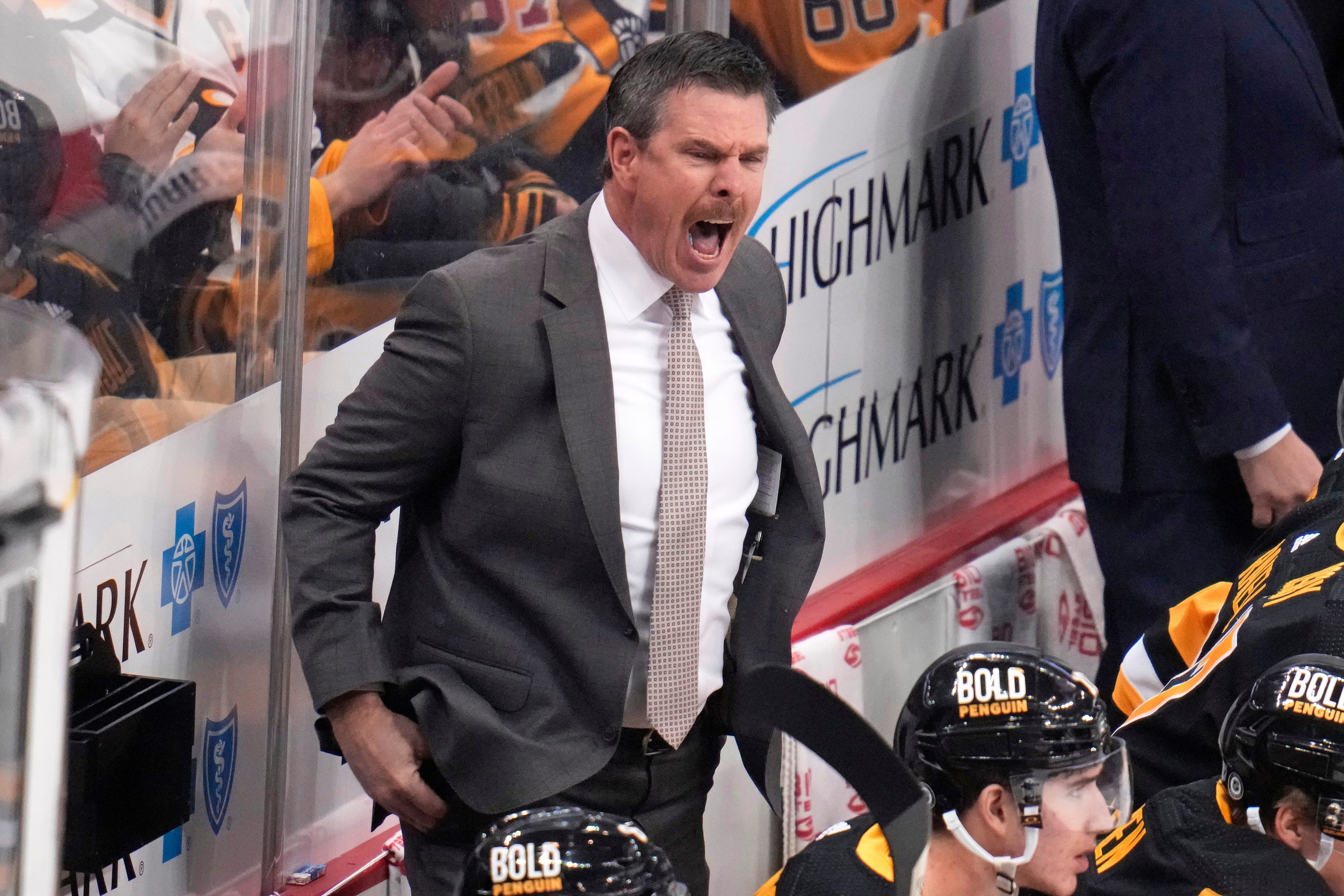 Pittsburgh Penguins coach Mike Sullivan gives instructions during the first period of the team's NHL hockey game against the Detroit Red Wings in Pittsburgh, Wednesday, Dec. 28, 2022.